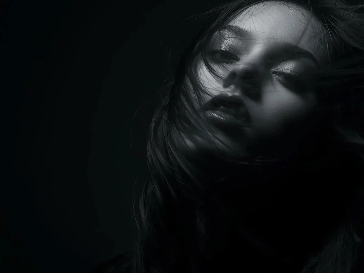moody editorial beauty portrait, blurred face, dark studio lighting, glossy hair movement, industrial shadows, soft motion blur, underground fashion photography, occult minimalism, cinematic grain, muted charcoal tones, high contrast, mysterious…-2.jpg