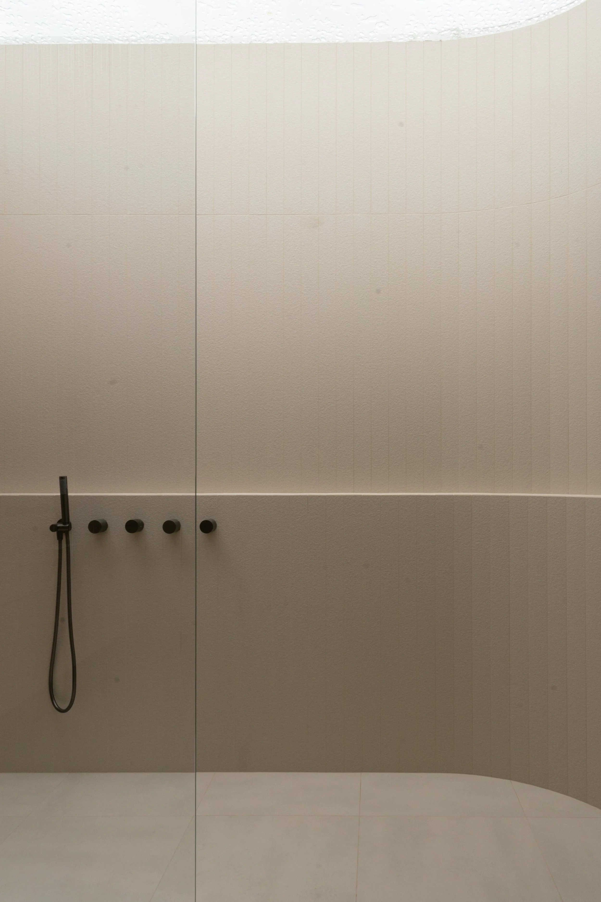 Large format tiled shower wall with gun metal tapware, Melbourne bathroom