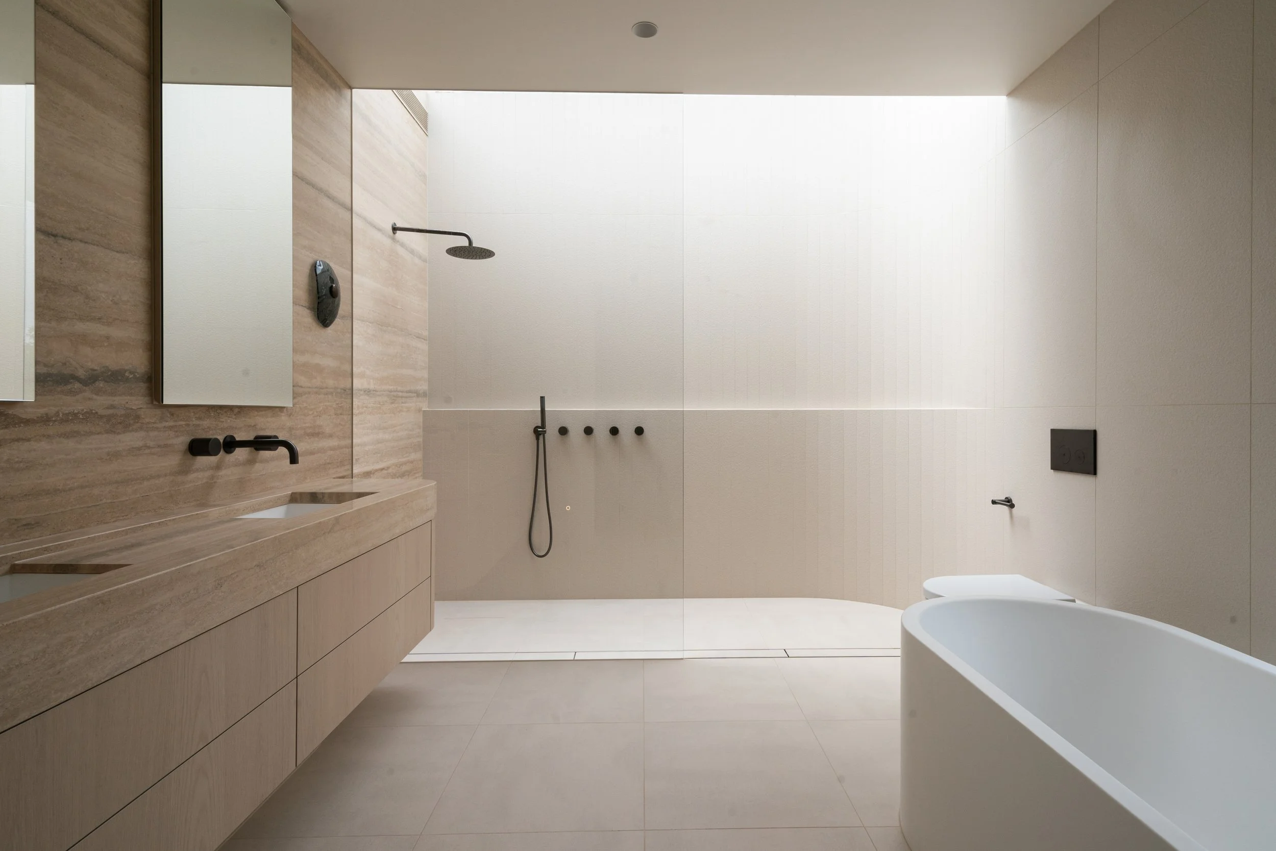 Large format tiled shower wall with gun metal tapware, Melbourne bathroom