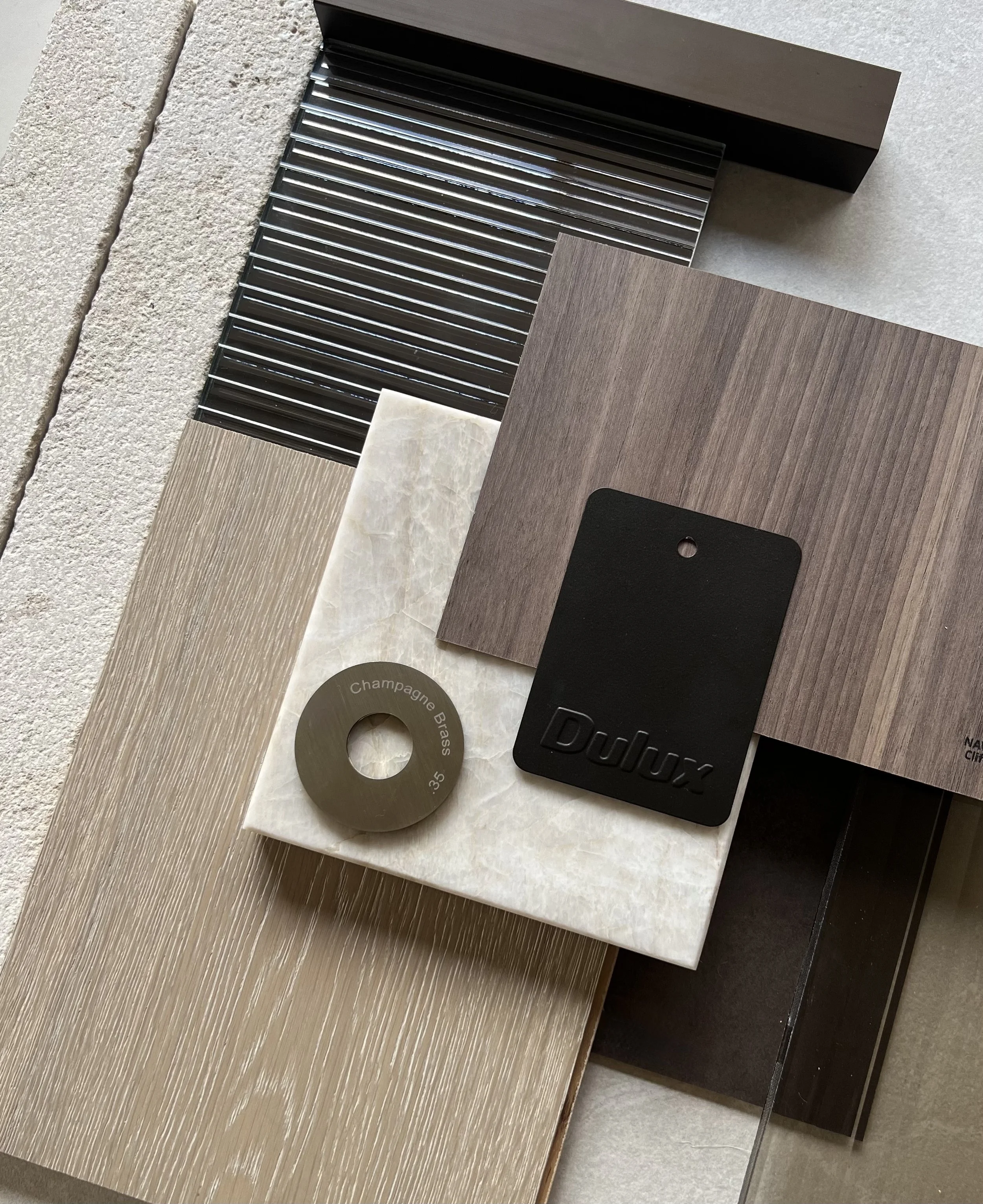 Material selections for a Melbourne interior — timber veneer, stone and brass by lisabreen.studio