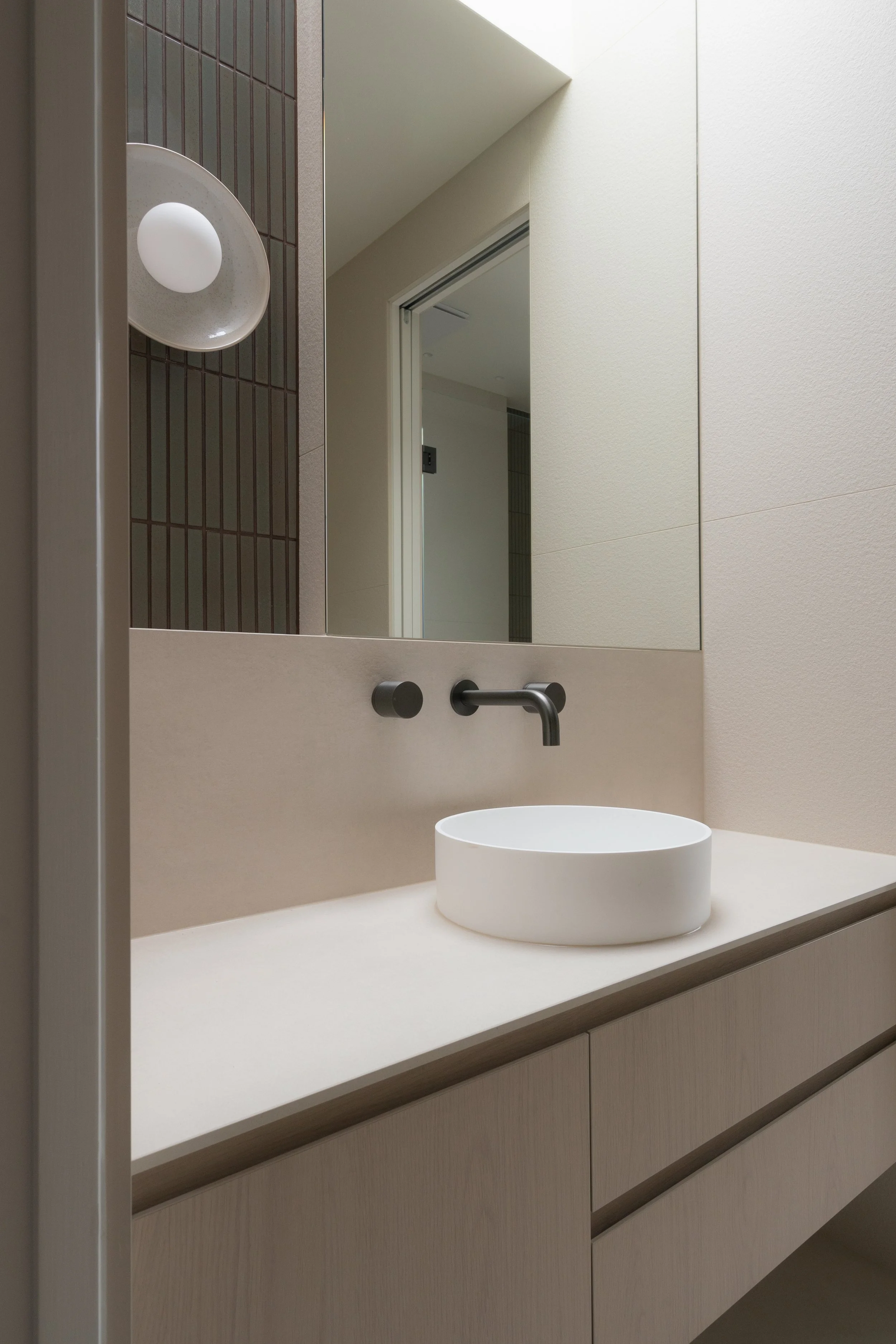 Porcelain vanity with vessel basin and wall-mounted tapware, Melbourne
