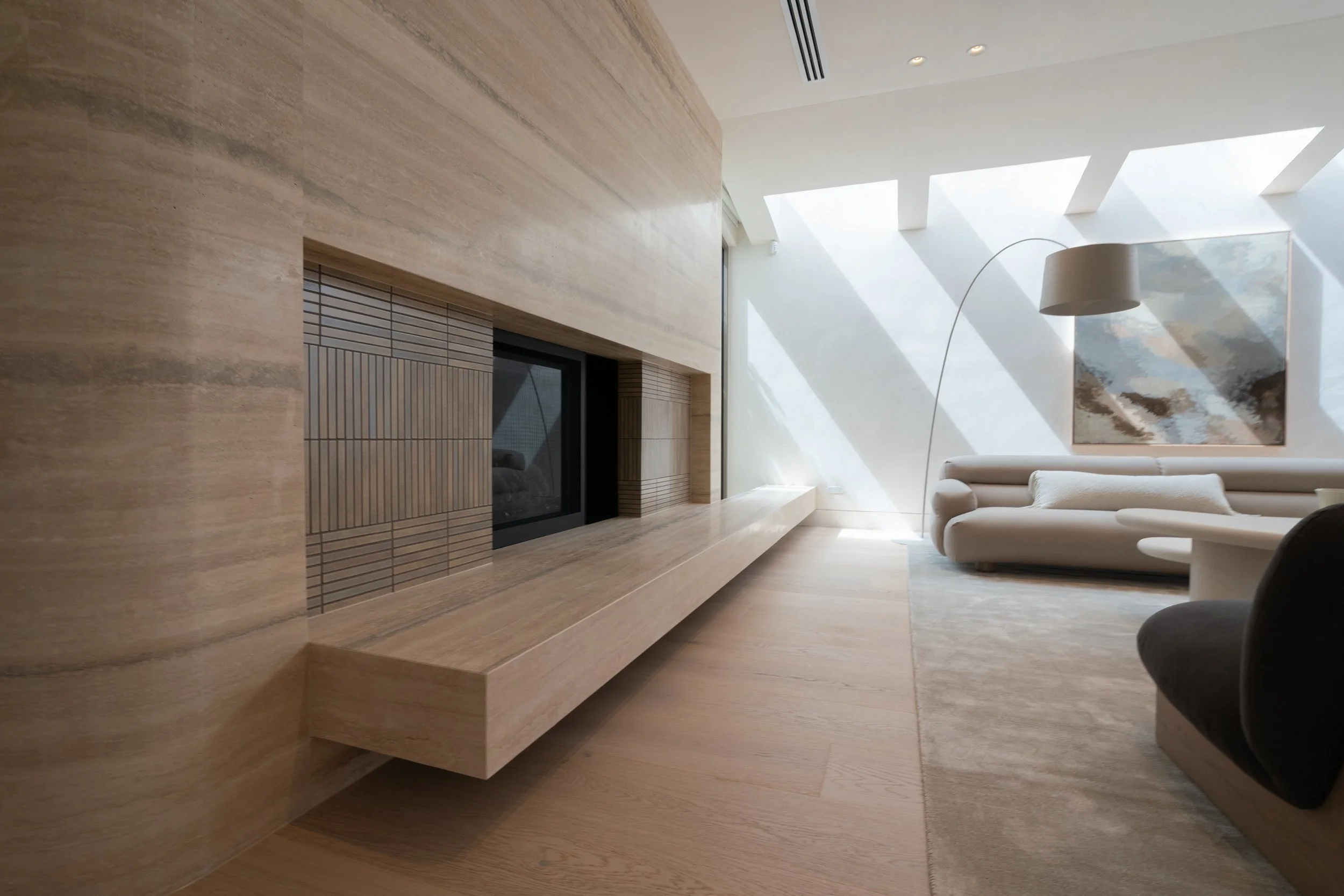 Melbourne Travertine fireplace surround with cantelivered hearth