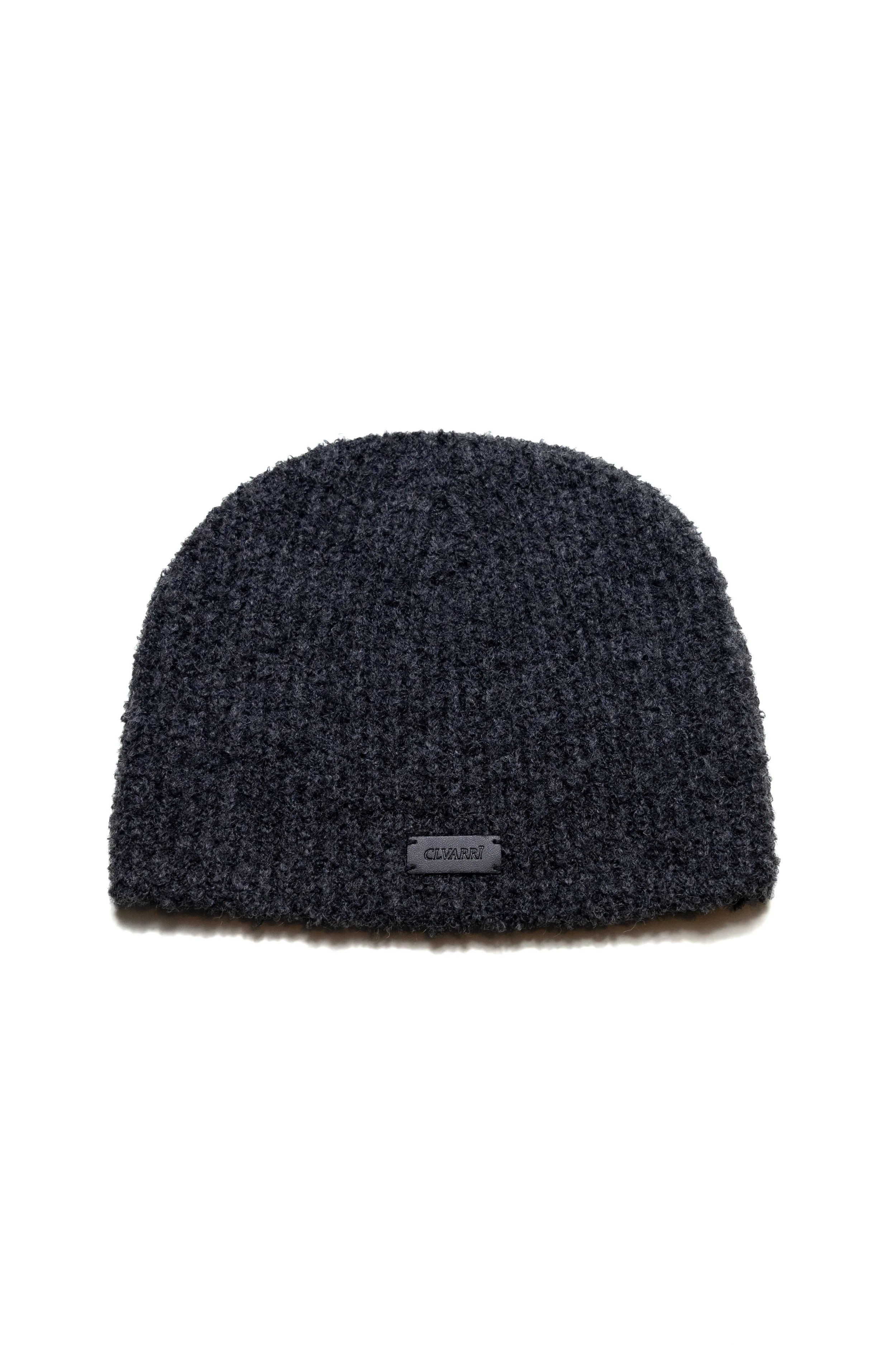 Black knitted beanie hat with a small rectangular logo tag that reads "Cluvarri" on the front.
