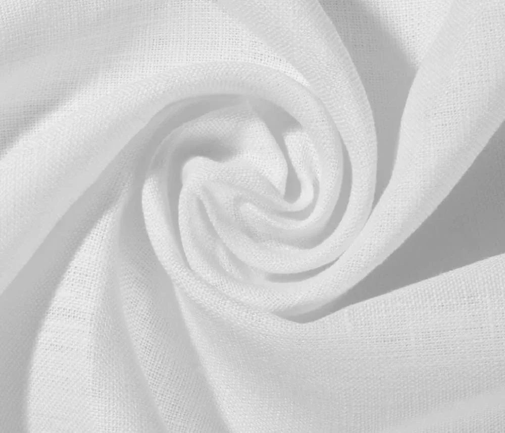 Close-up of white fabric twisted into a spiral pattern.