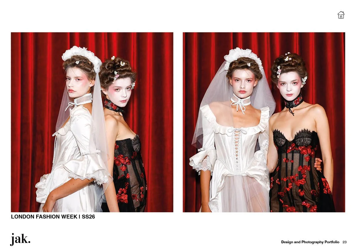Four young women standing in front of red curtains wearing bridal and evening wear outfits with floral and lace details at London Fashion Week SS26.