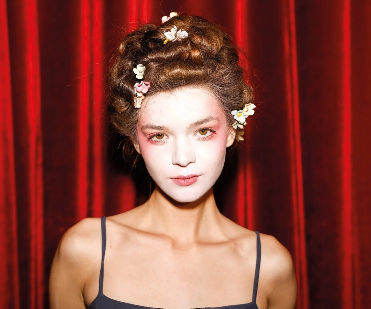 Backstage fashion photography in an editorial style during fashion week.