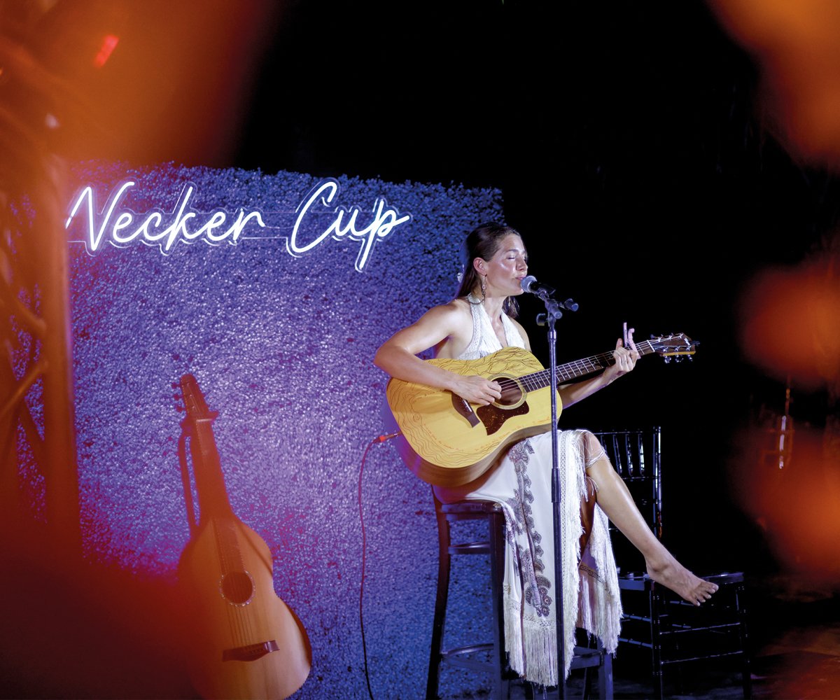 Luxury event photography capturing candid moments between guests at a private brand event