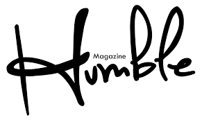 Logo with the word 'Humble' in handwritten style with 'Magazine' written above the letter 'm'.