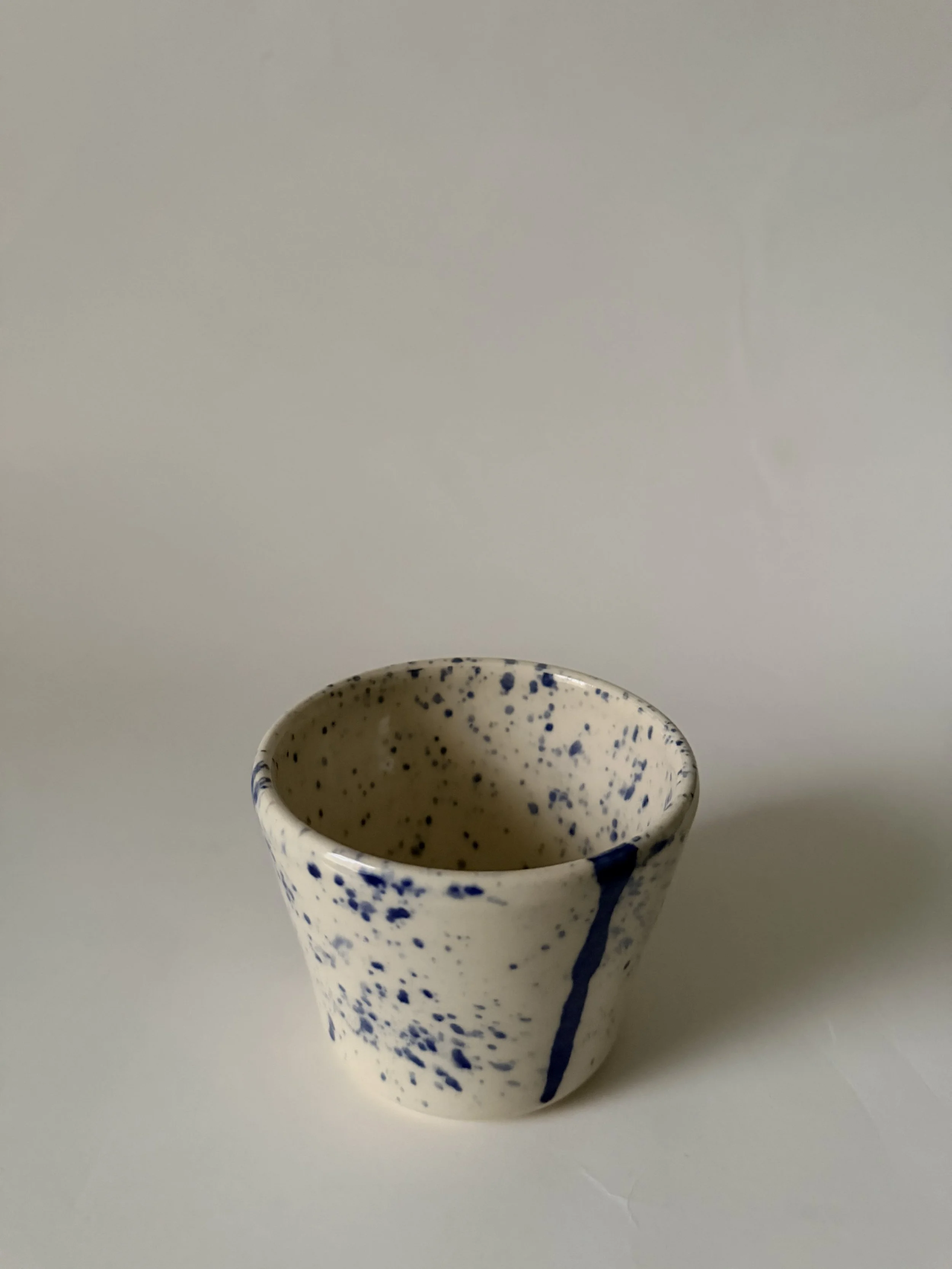Blue splattered cup