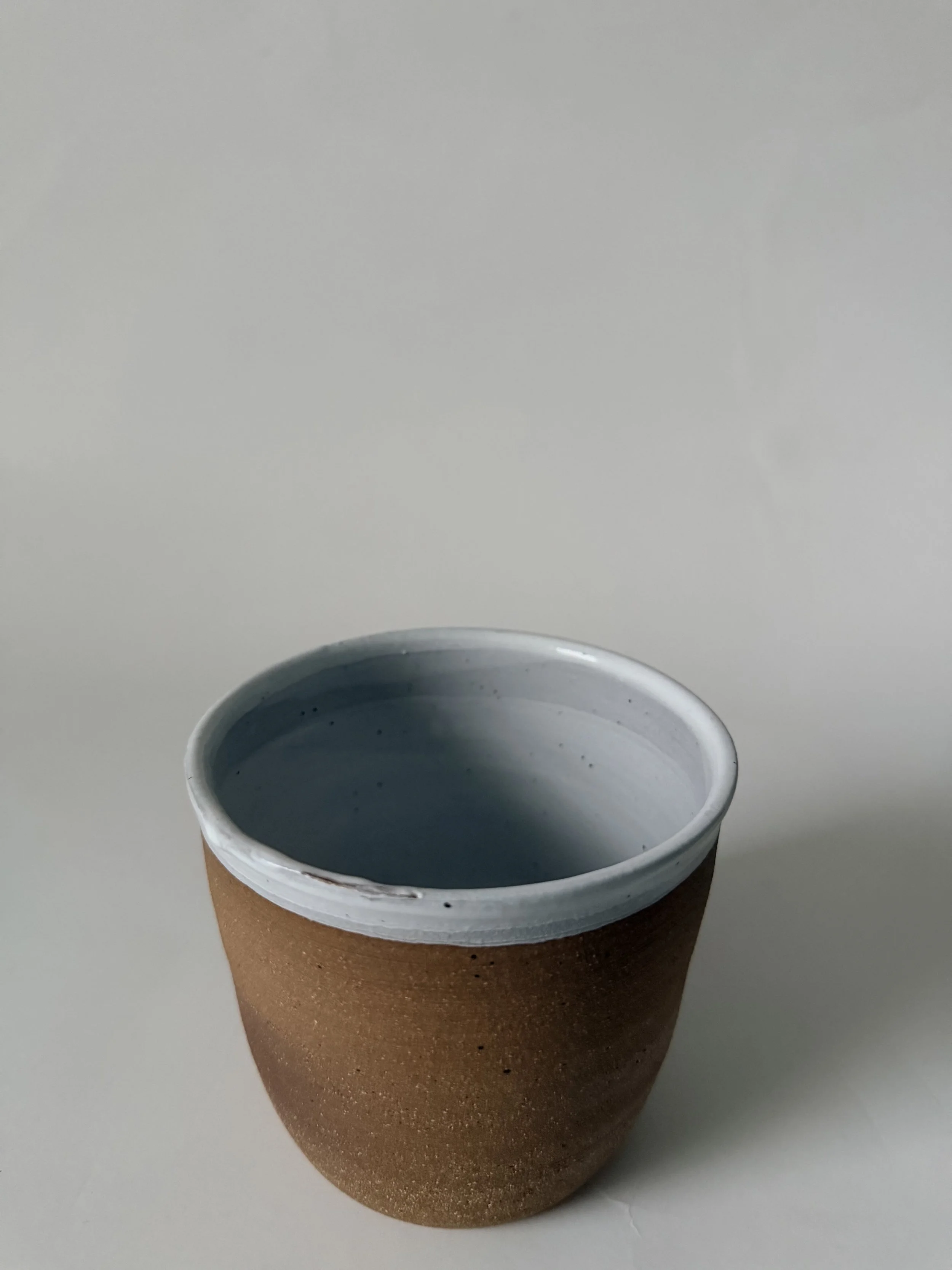 White rimmed cup