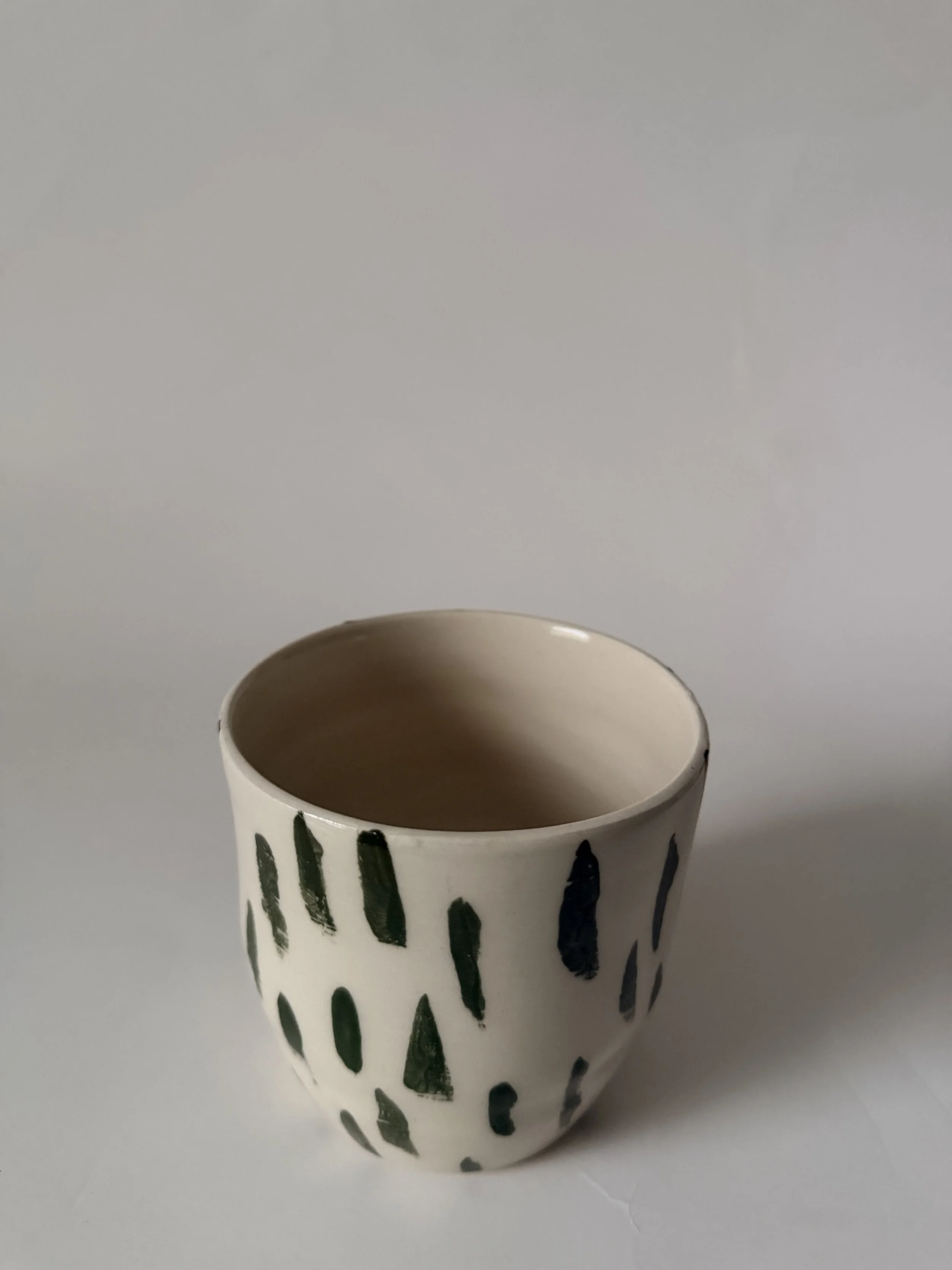 Cup with green strikes