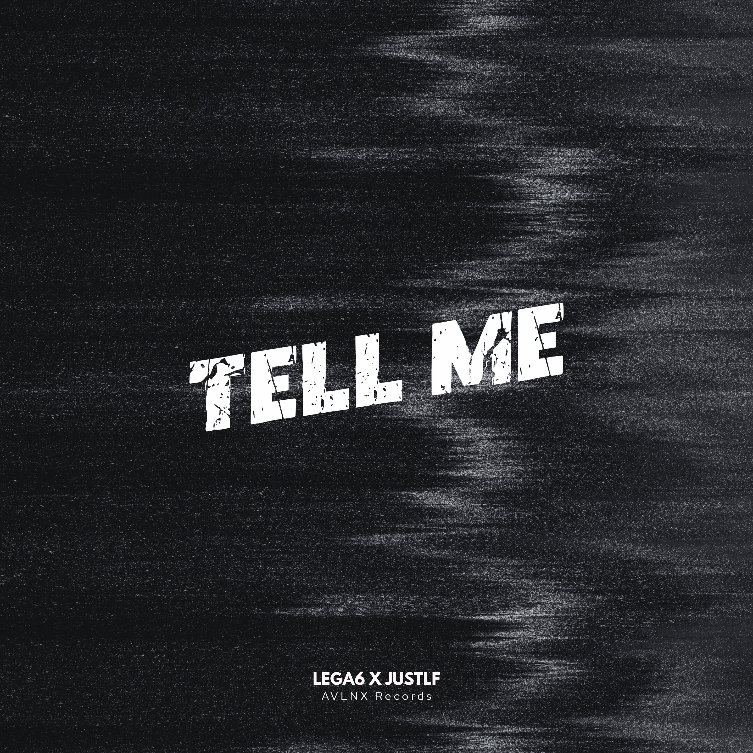 Une image noire avec le texte blanc 'TELL ME' en lettres effilées et déchirées, accompagné en dessous par 'LEGA6 X JUSTLF AVLNX Records'.