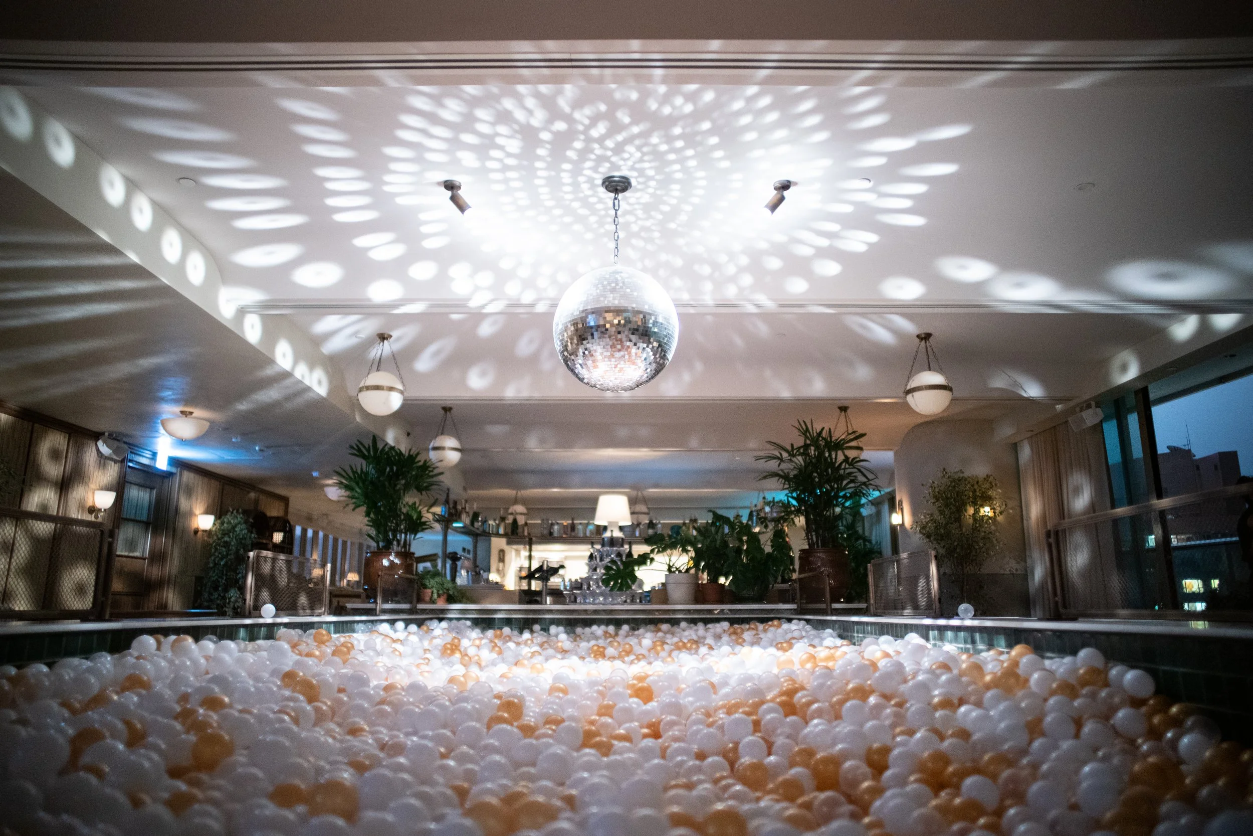 Soho House rooftop swimming pool transformed into adult ball pit for experiential NYE activation