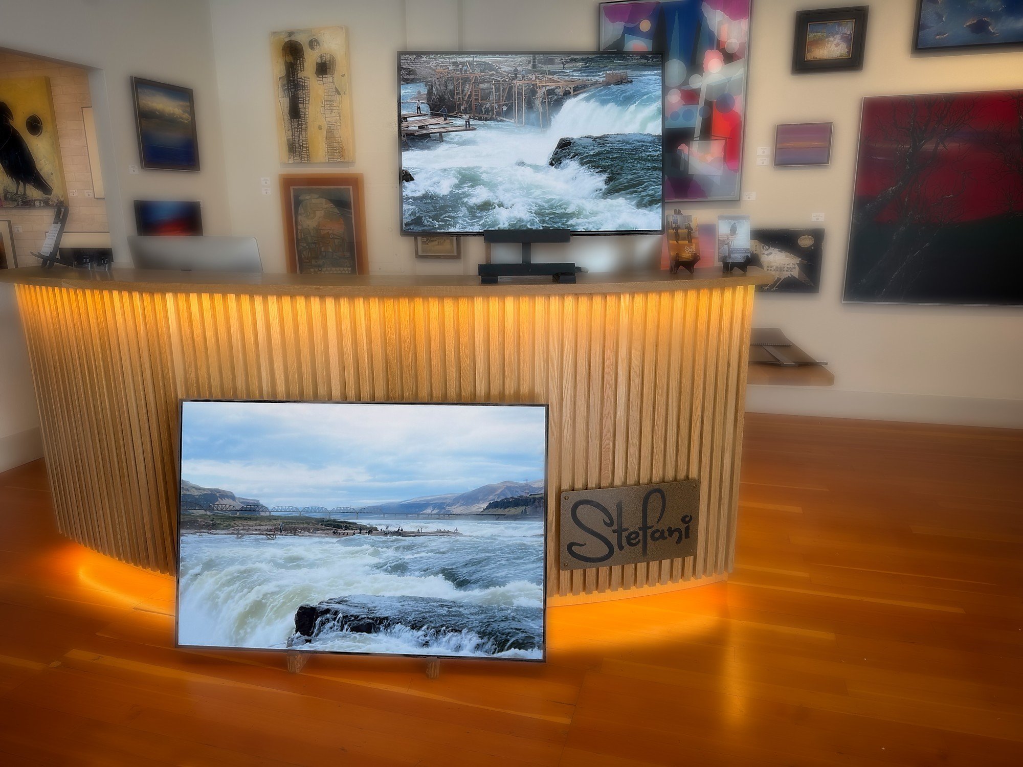 Two Celilo Falls photographs leaning against the desk at Stefani Art Gallery, Salem Oregon