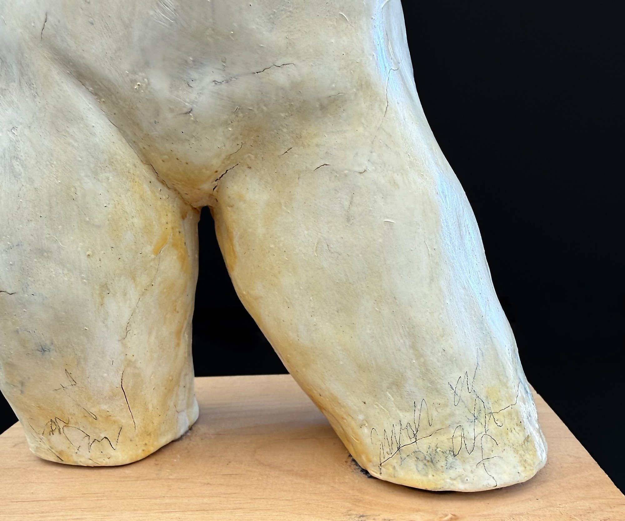 Graphite, incised lines, tonal variation, and traces of the artist's working process remain visible across the porcelain surface.