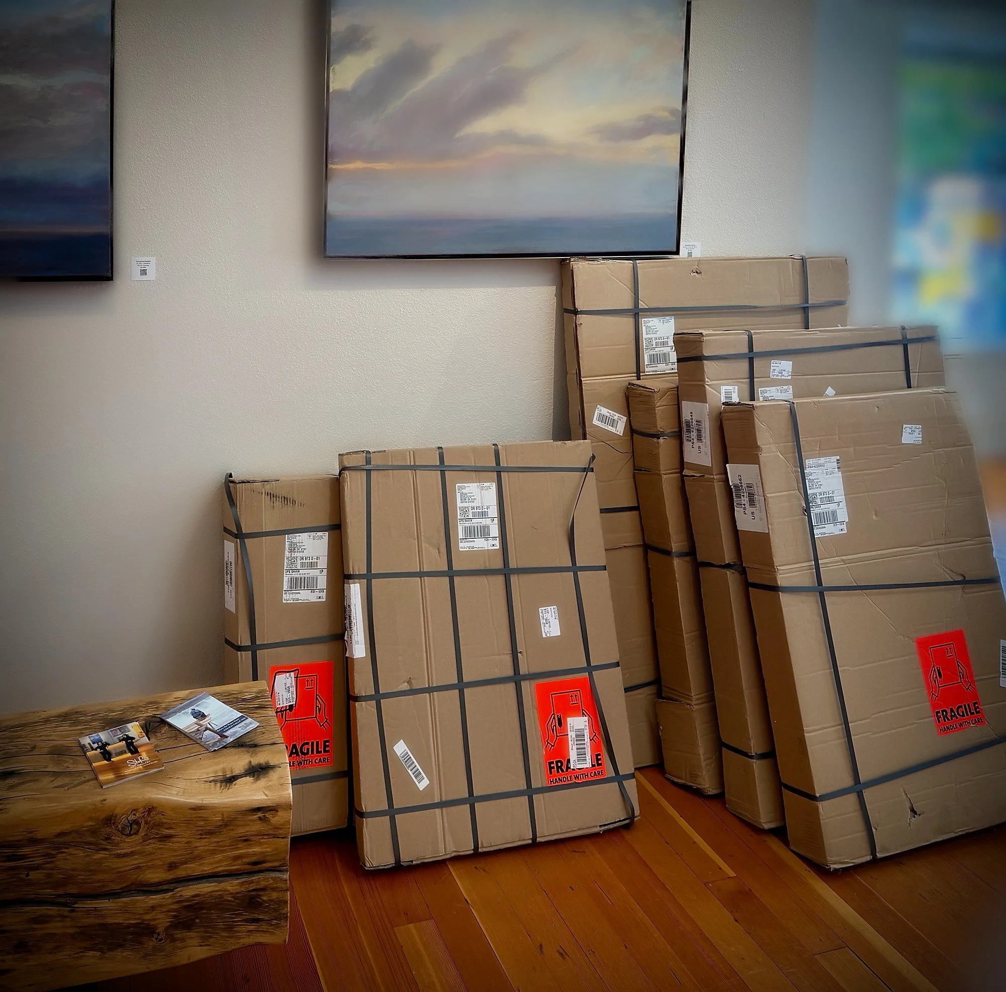 photos in boxes with fragile label in Stefani Art Gallery