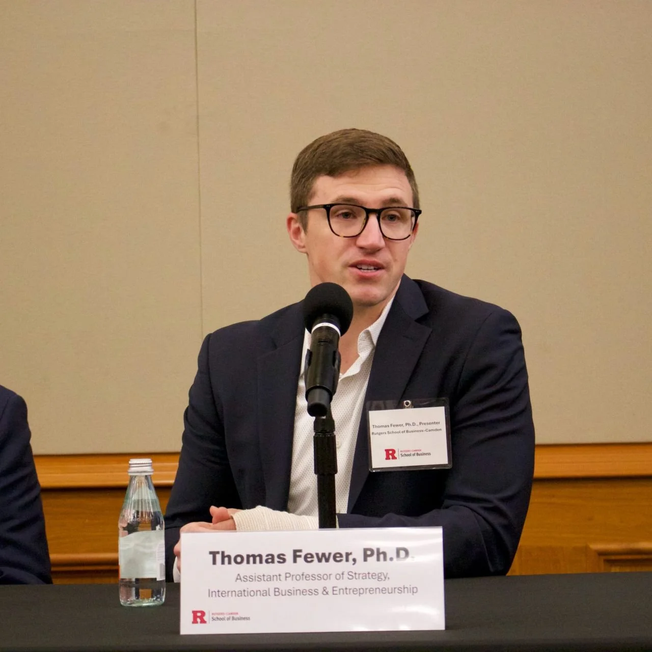 Thomas J. Fewer, Ph.D., Assistant Professor of Strategy, speaking on a panel discussion about business and society.