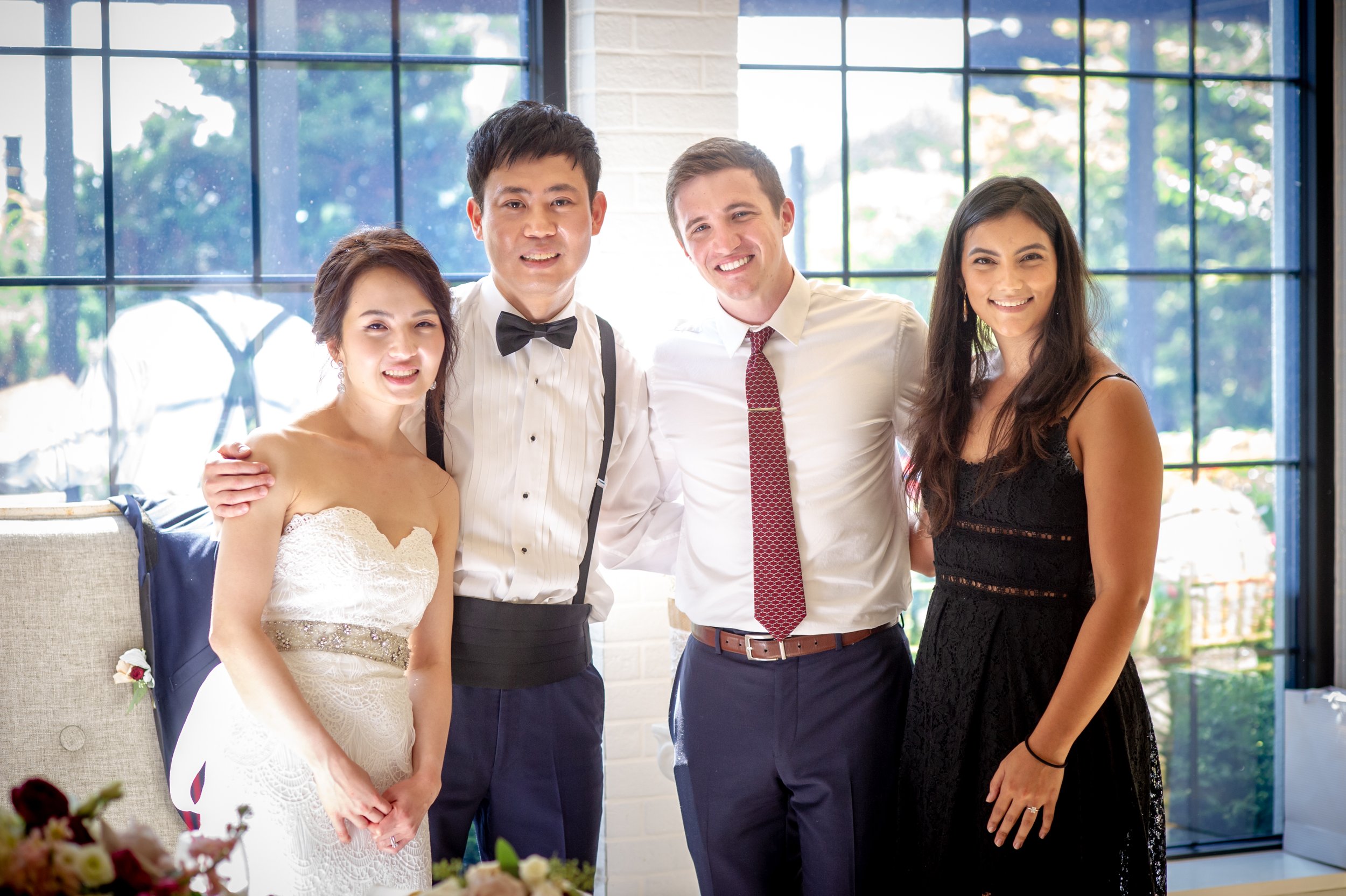 Thomas J. Fewer visiting with international colleagues at a formal event.