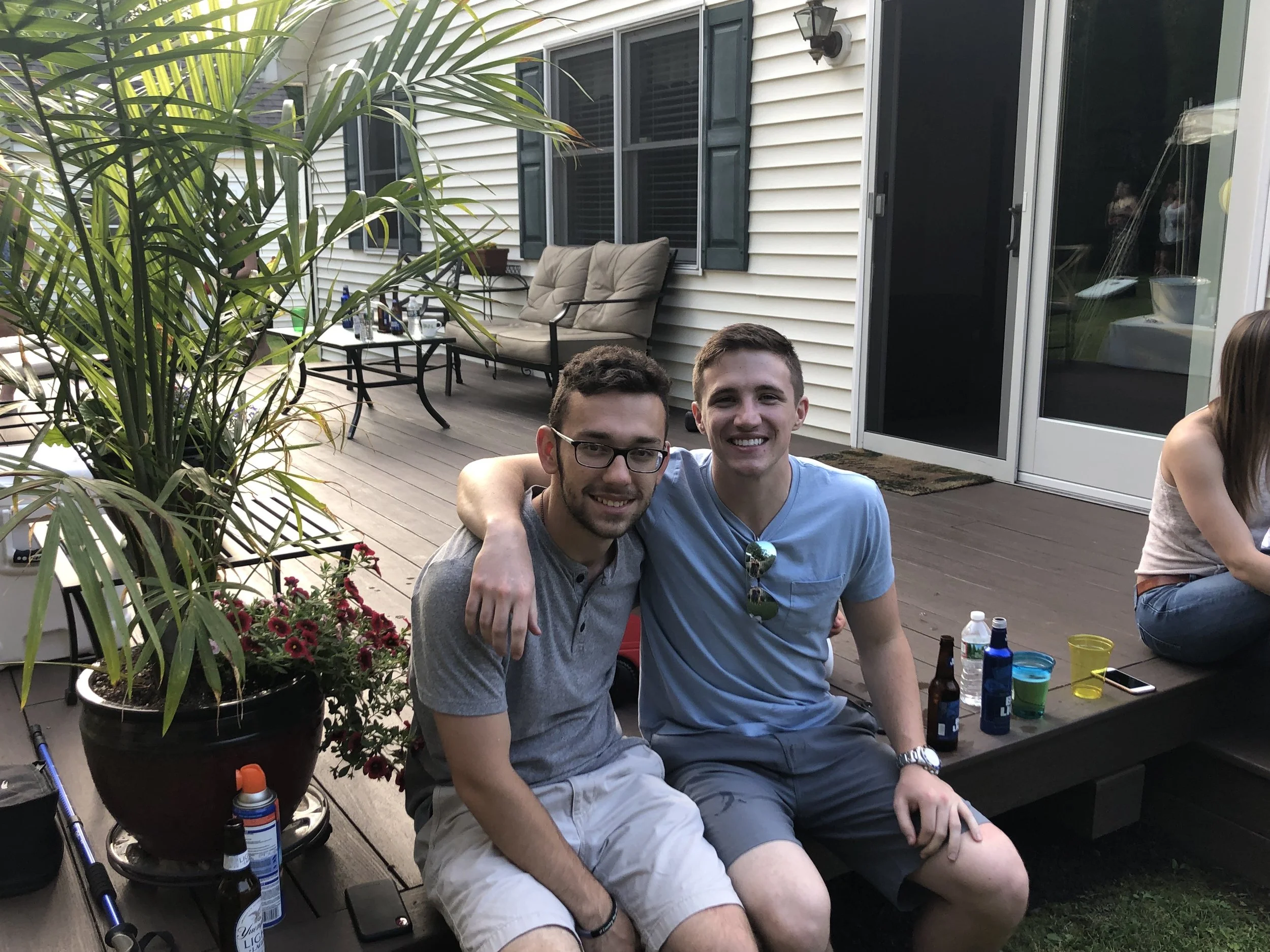 Thomas J. Fewer with a colleague at an informal work event.