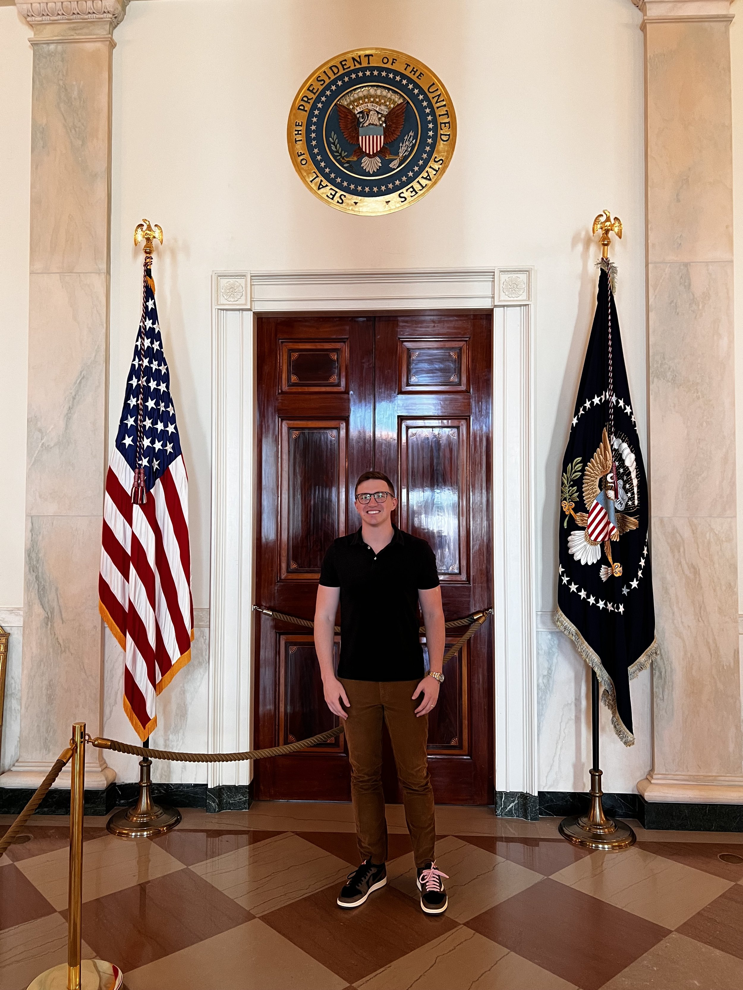 Thomas J. Fewer inside a U.S. government building during policy-related work.