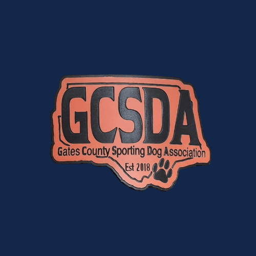 Logo of Gates County Sporting Dog Association featuring an outline of the state of North Carolina, the text 'GCSDA Gates County Sporting Dog Association Est 2018', and a paw print.
