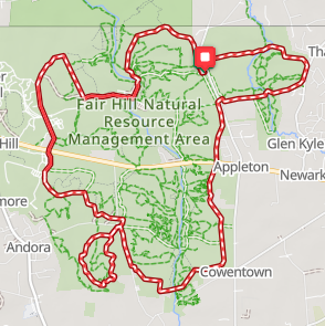 Map of Fair Hill Natural Resource Management Area with red trail outline, surrounding roads, and nearby towns of Appleton, Newark, and Cowentown.