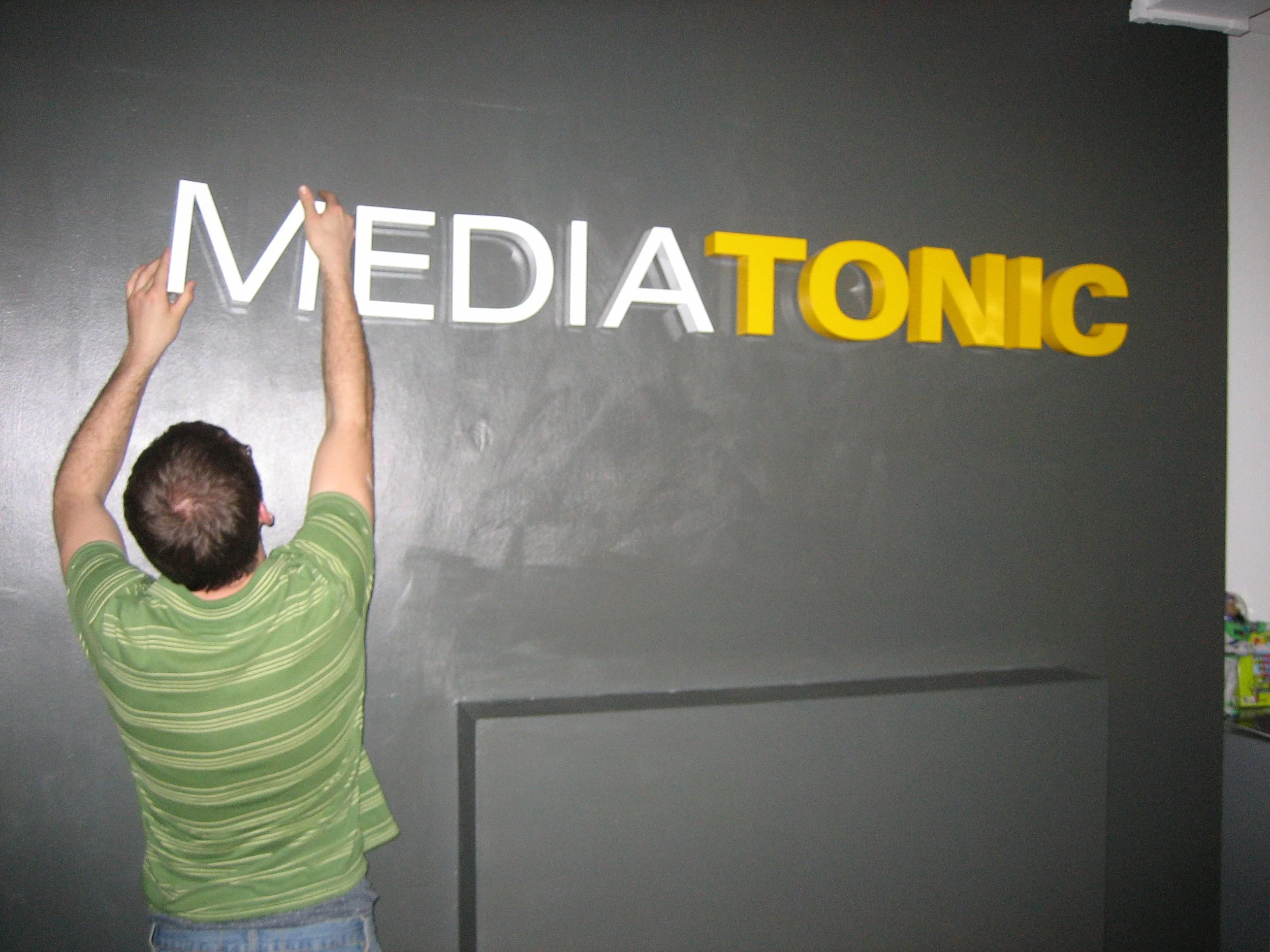 Putting up our first sign.JPG