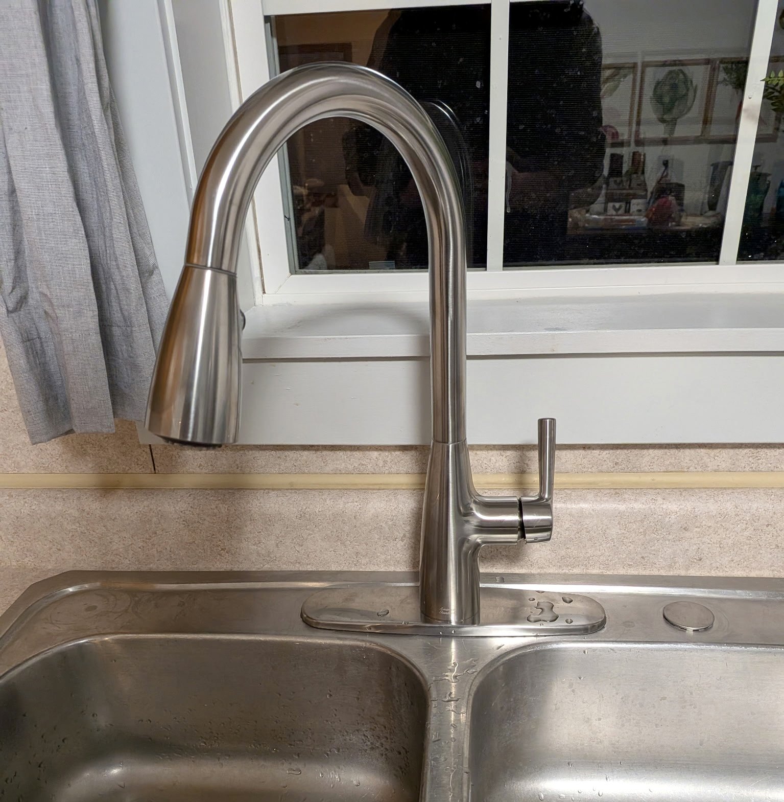 Original faucet before replacement.
