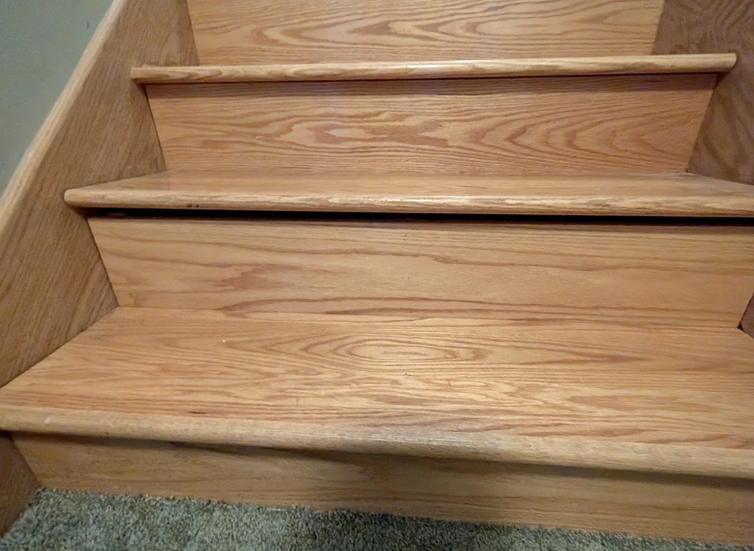 Loose stair and damaged stair tread showing visible movement.