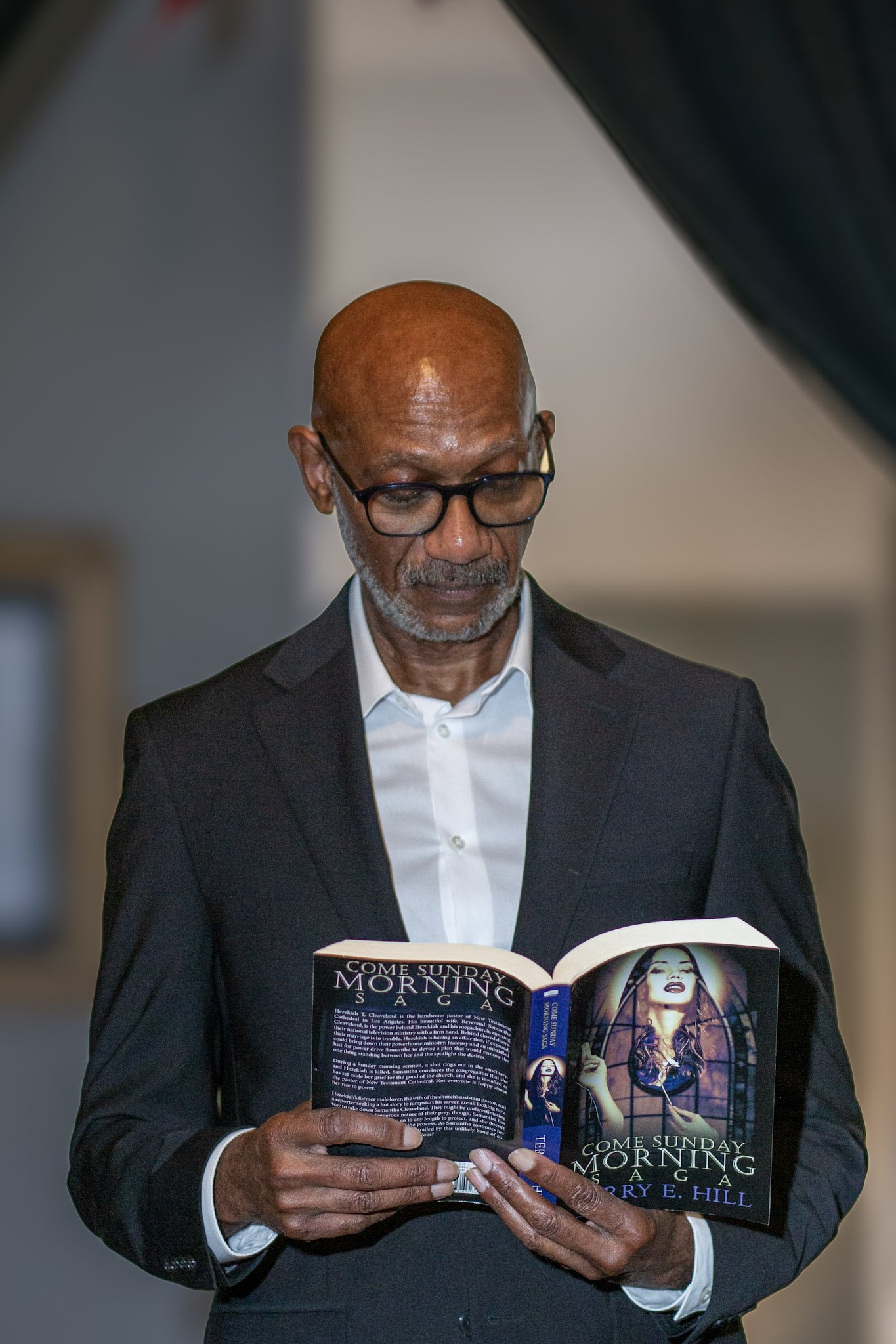Image of Author Terry E Hill reading a book