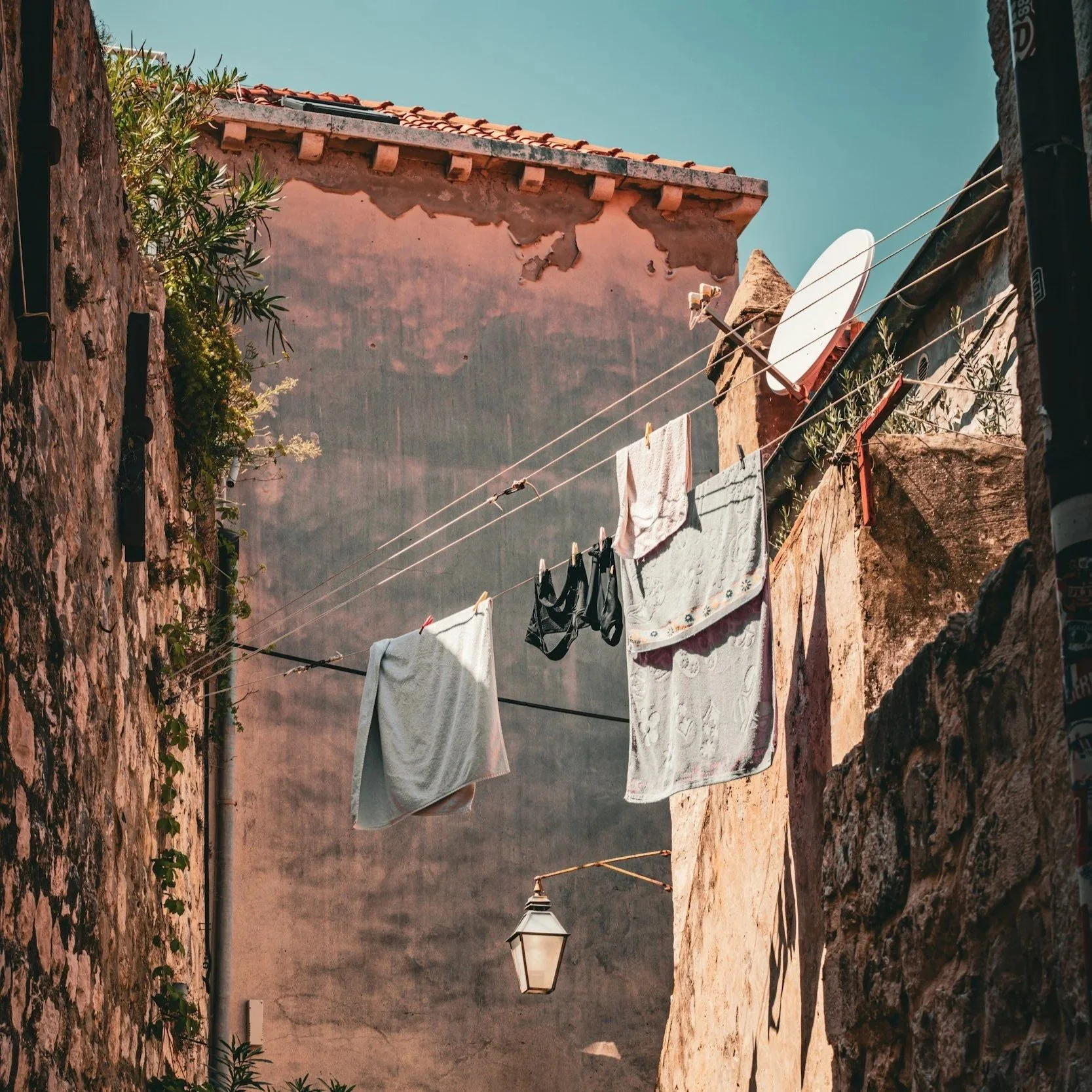 Laundry hanging in a narrow alley in Italy