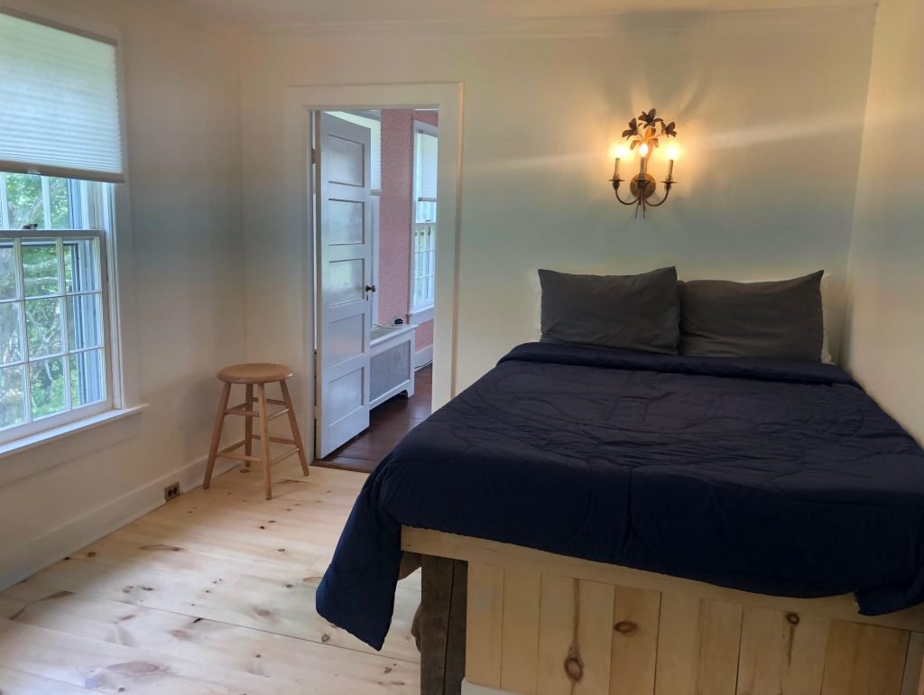 Rooms 3 and 4 are part of a suite that shares one full-bathroom. Suite includes a king-bedroom and a separate room with a full-bed. Featuring views of the property and the stream, this room is perfect for families or for two couples. 
