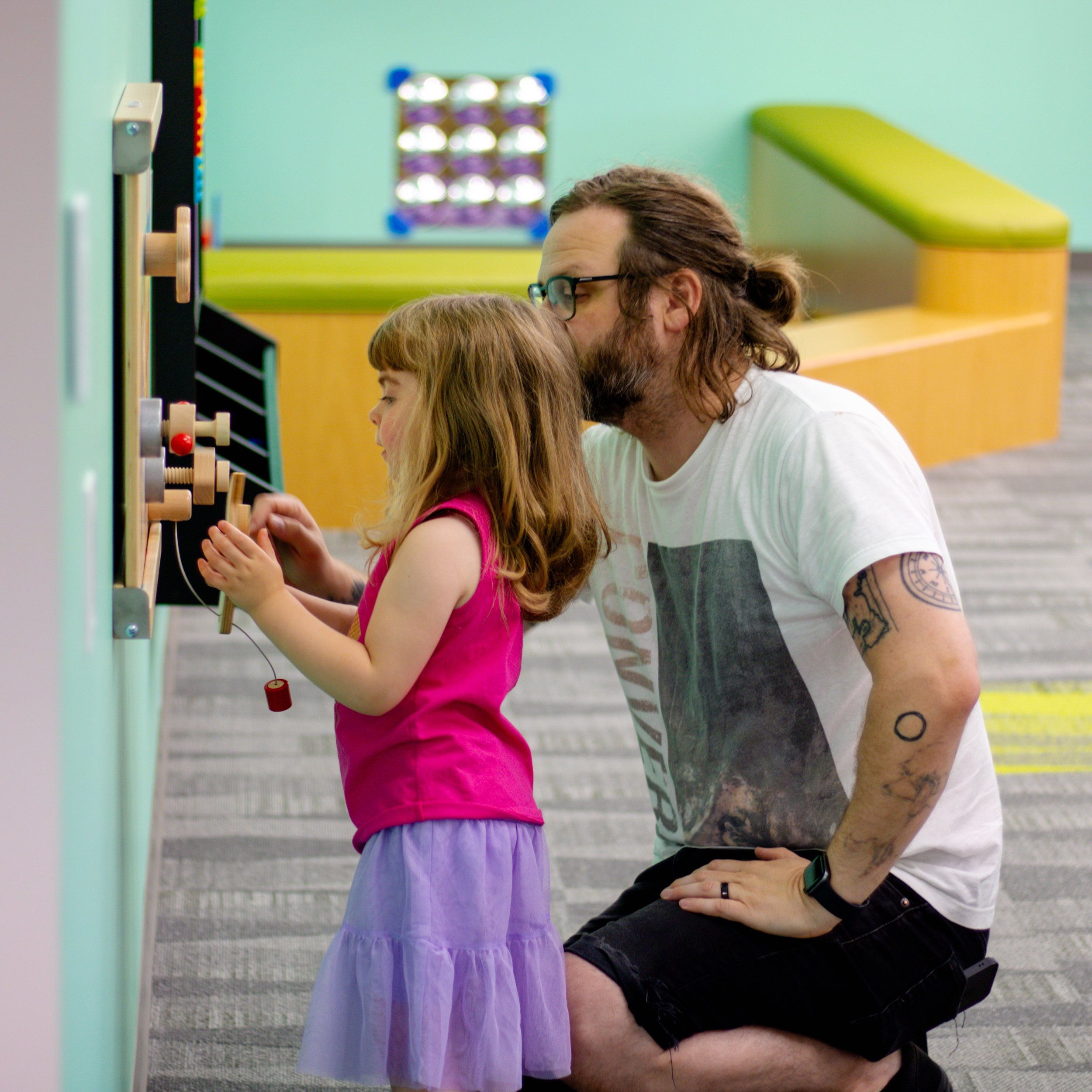 Father and daughter playing in the Discovery Room