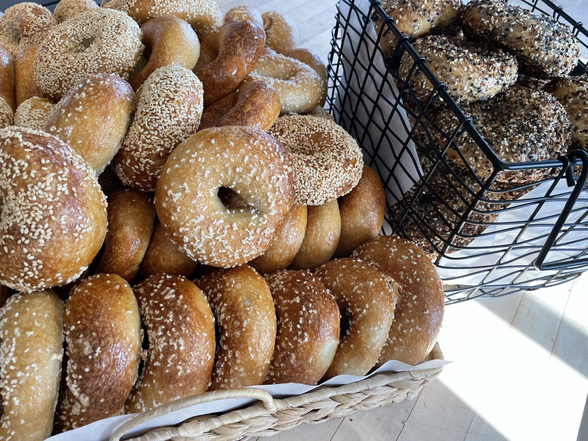 Assorted sourdough bagels for market day.