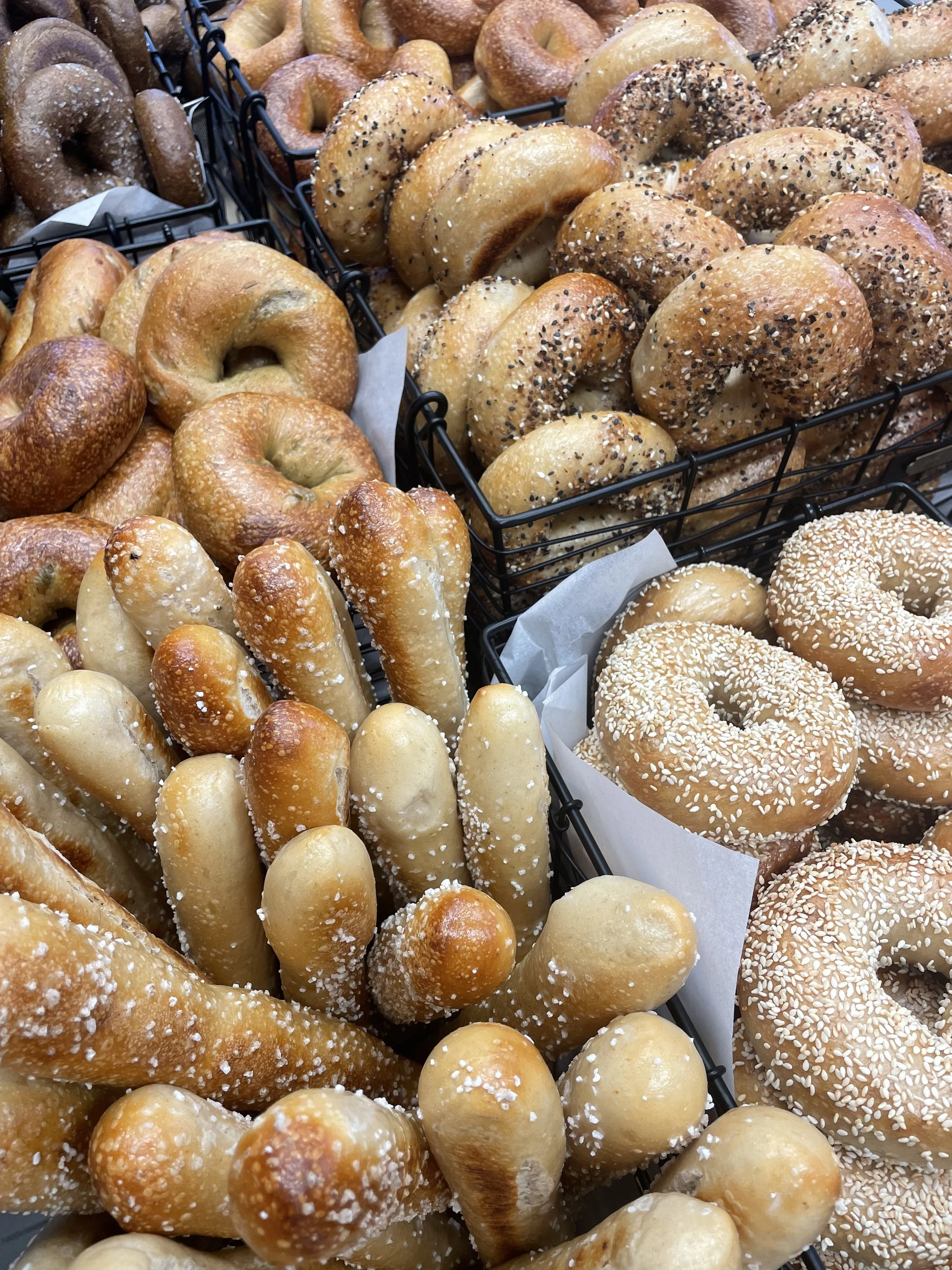 Classic sourdough bagels including plain, sesame, sea salt, and everything.