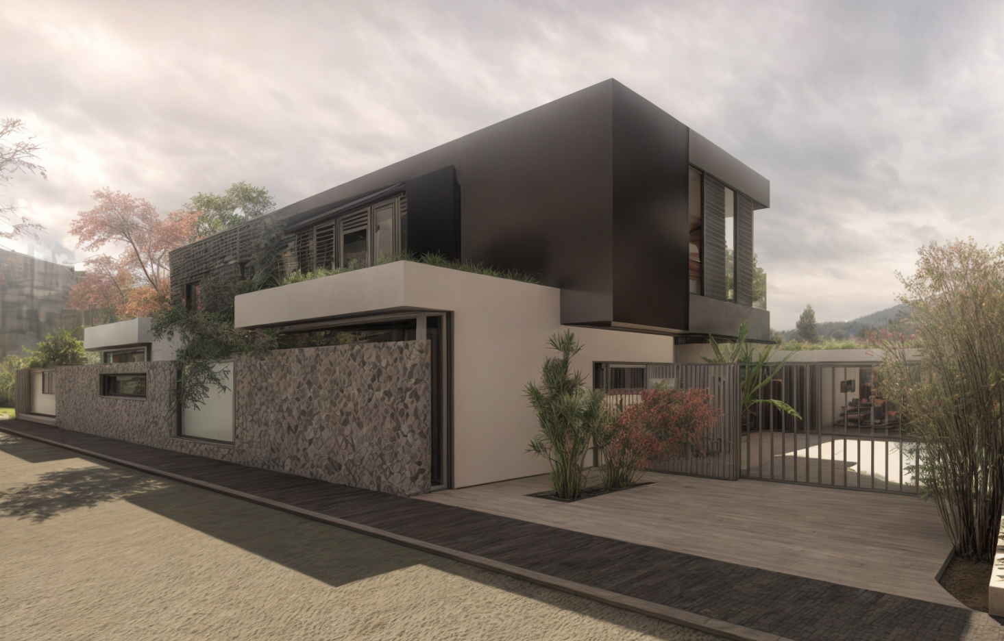 Une maison moderne avec un design minimaliste, façade en béton blanc et panneaux noirs, entourée de végétation et d'une clôture en métal, sous un ciel nuageux.