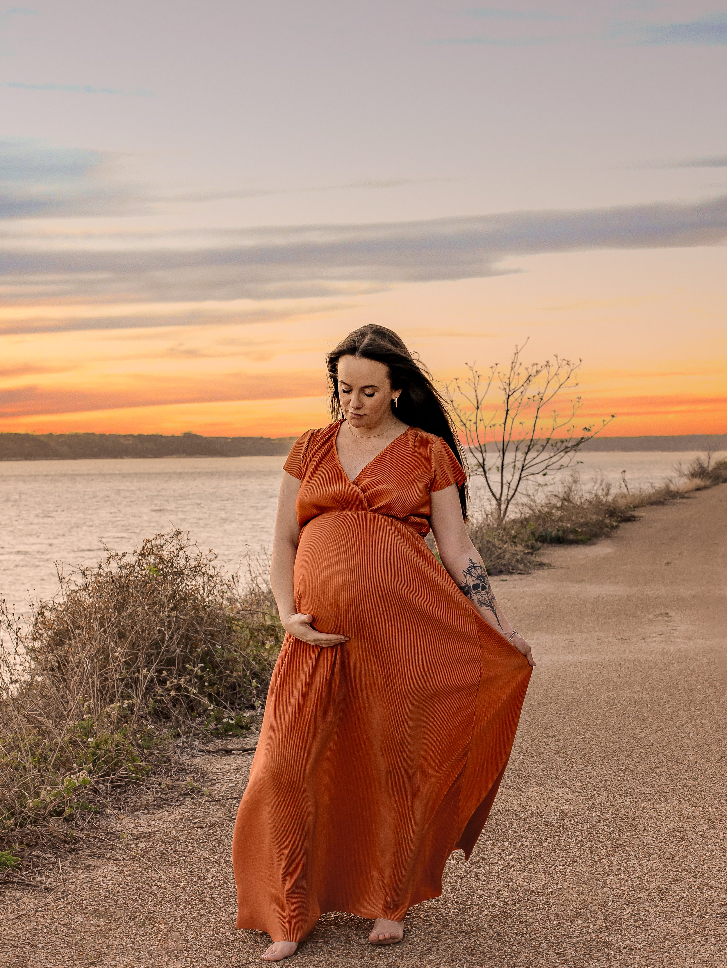 Outdoor maternity photo of an expectant mother by an Austin photographer.