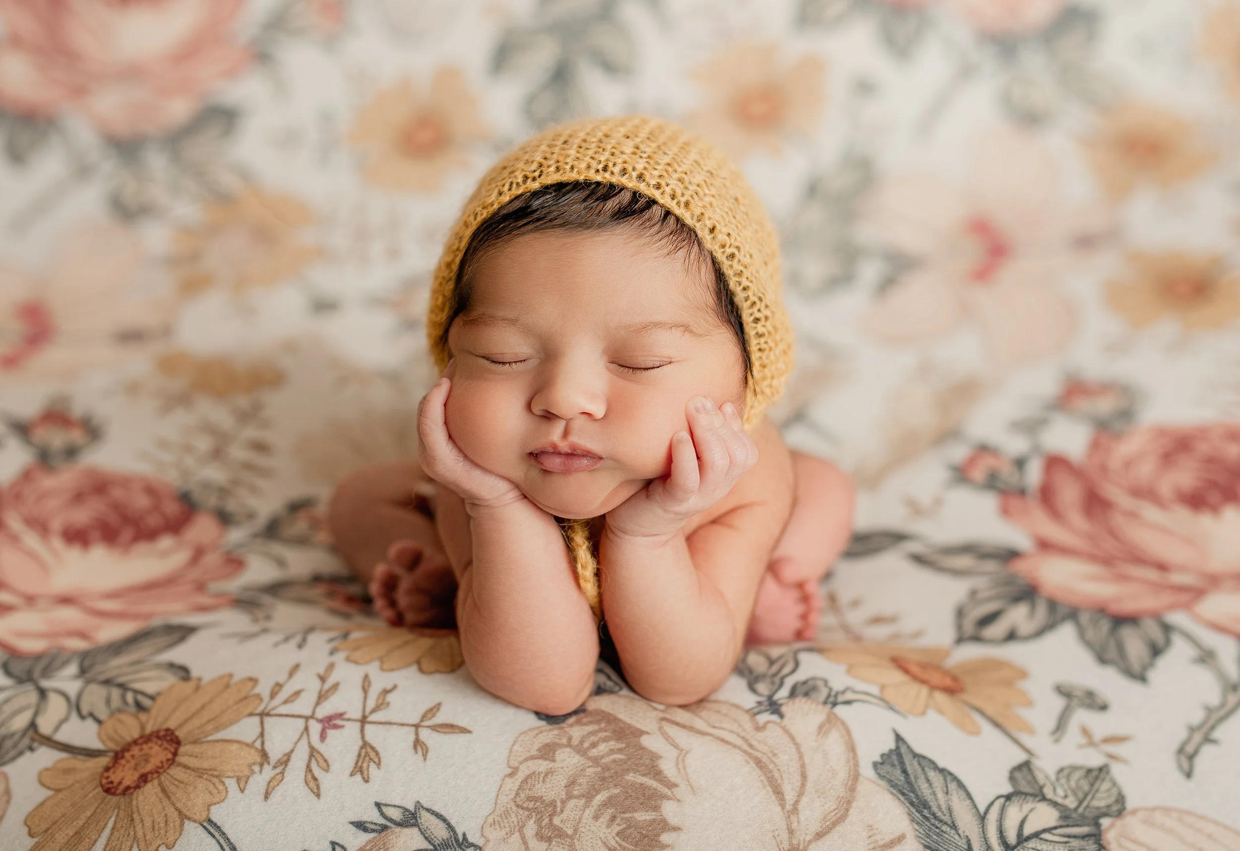 Newborn baby posed in an Austin photography studio