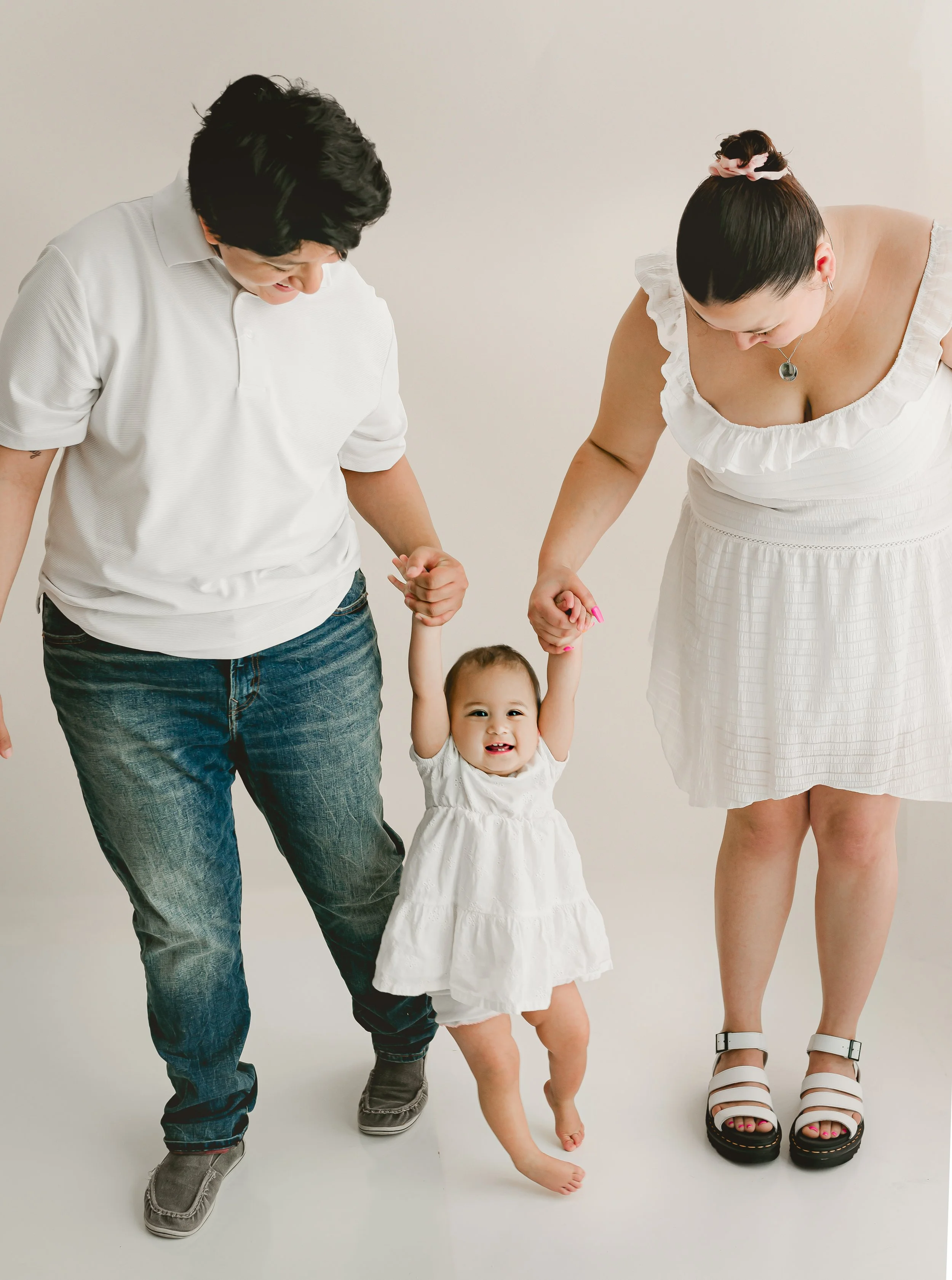 LGBTQ+ family laughing together during studio session in Round Rock, TX