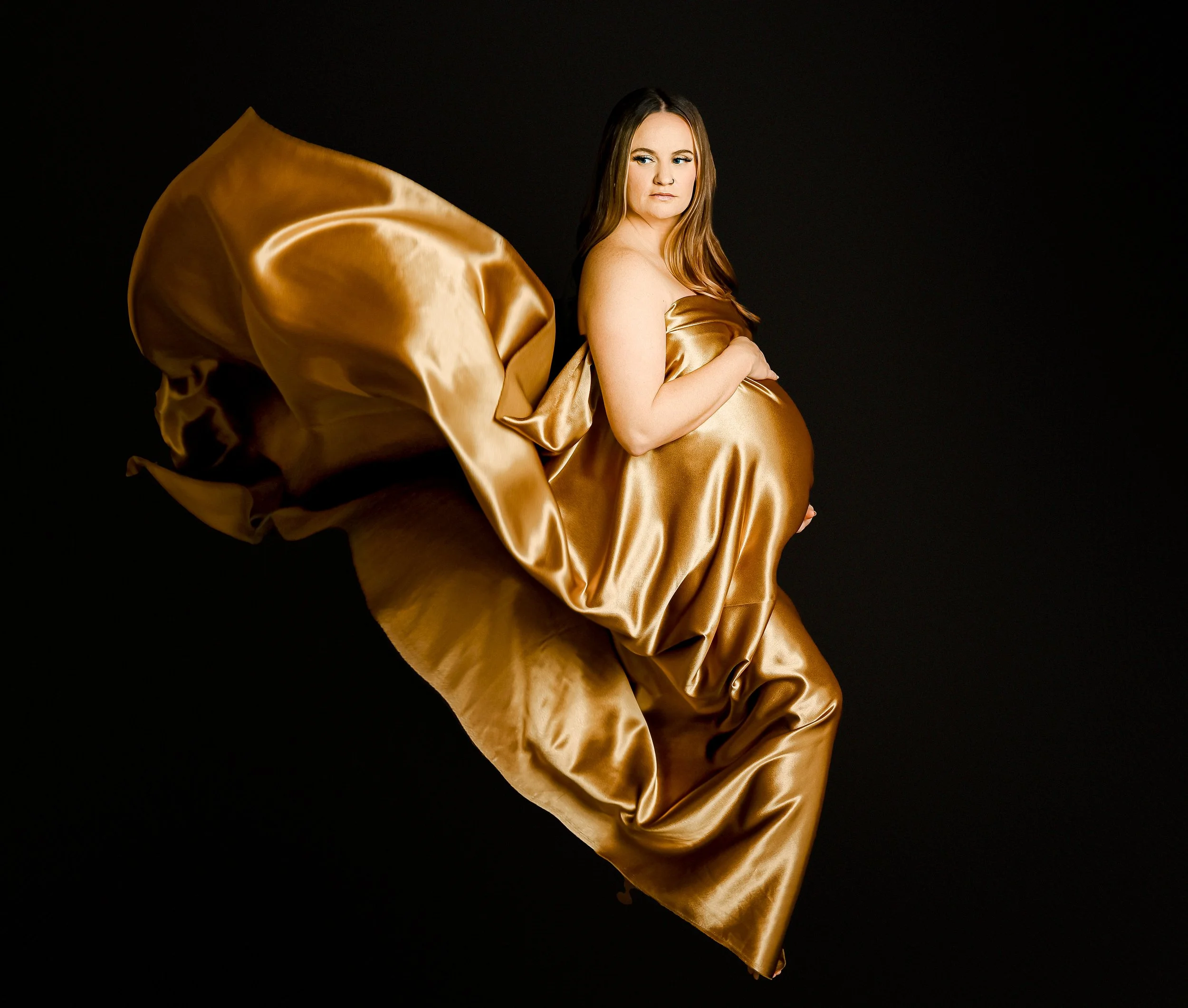 Minimalist studio maternity portrait of expecting mother in Round Rock