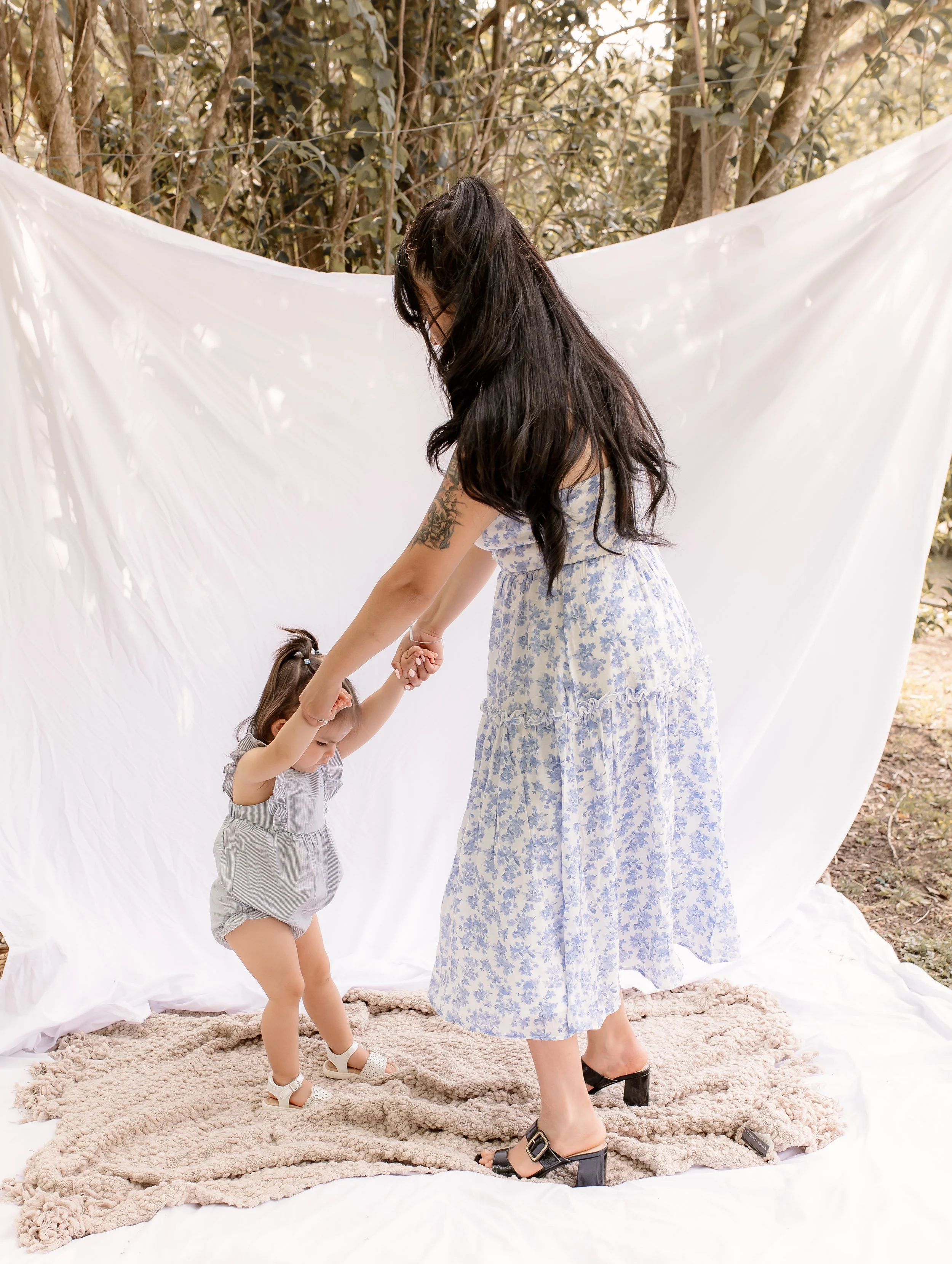 mom and daughter spinning in photo session