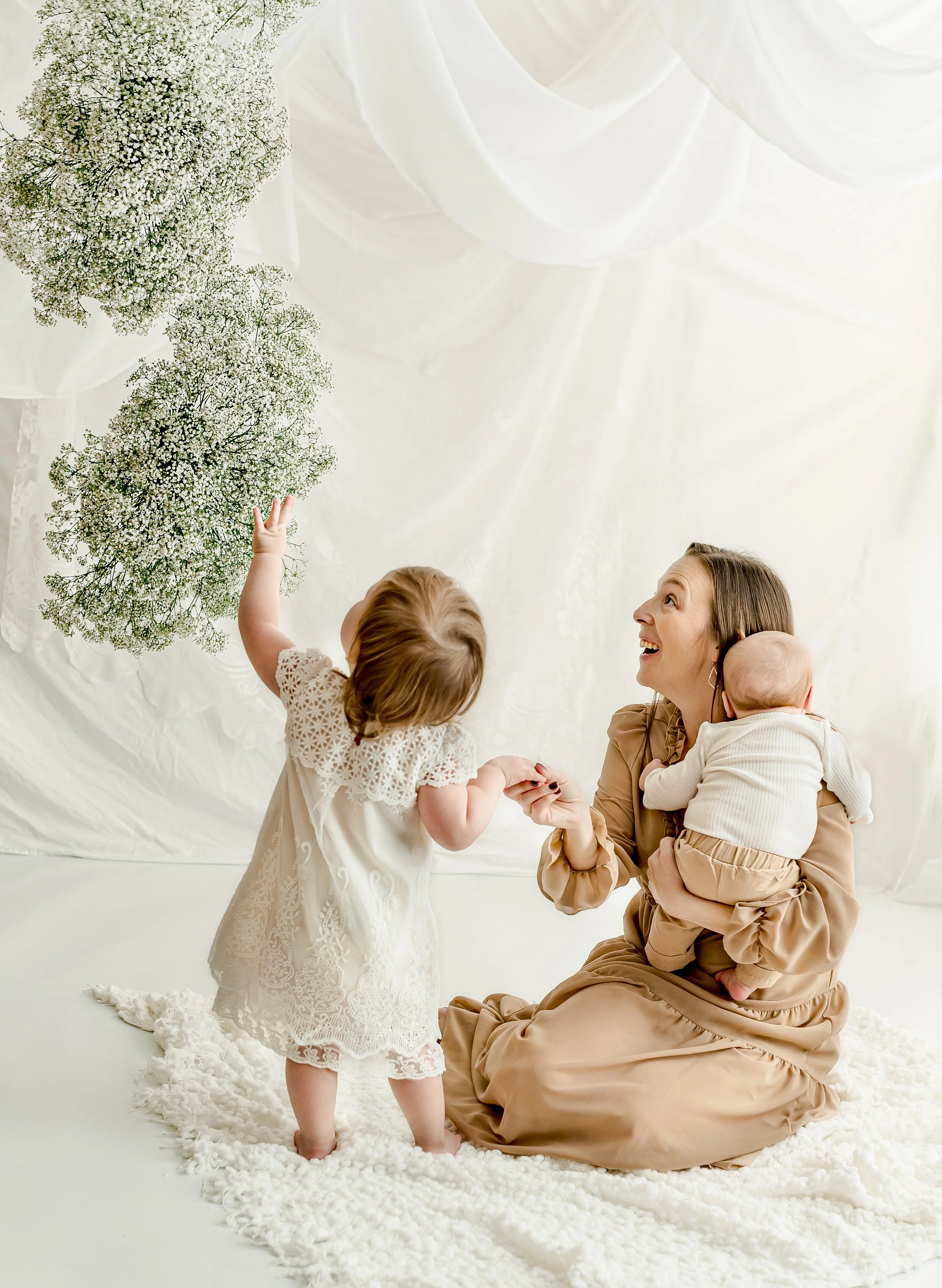 Mom and baby sitting together during in-studio Mom & Me session in Round Rock, TX