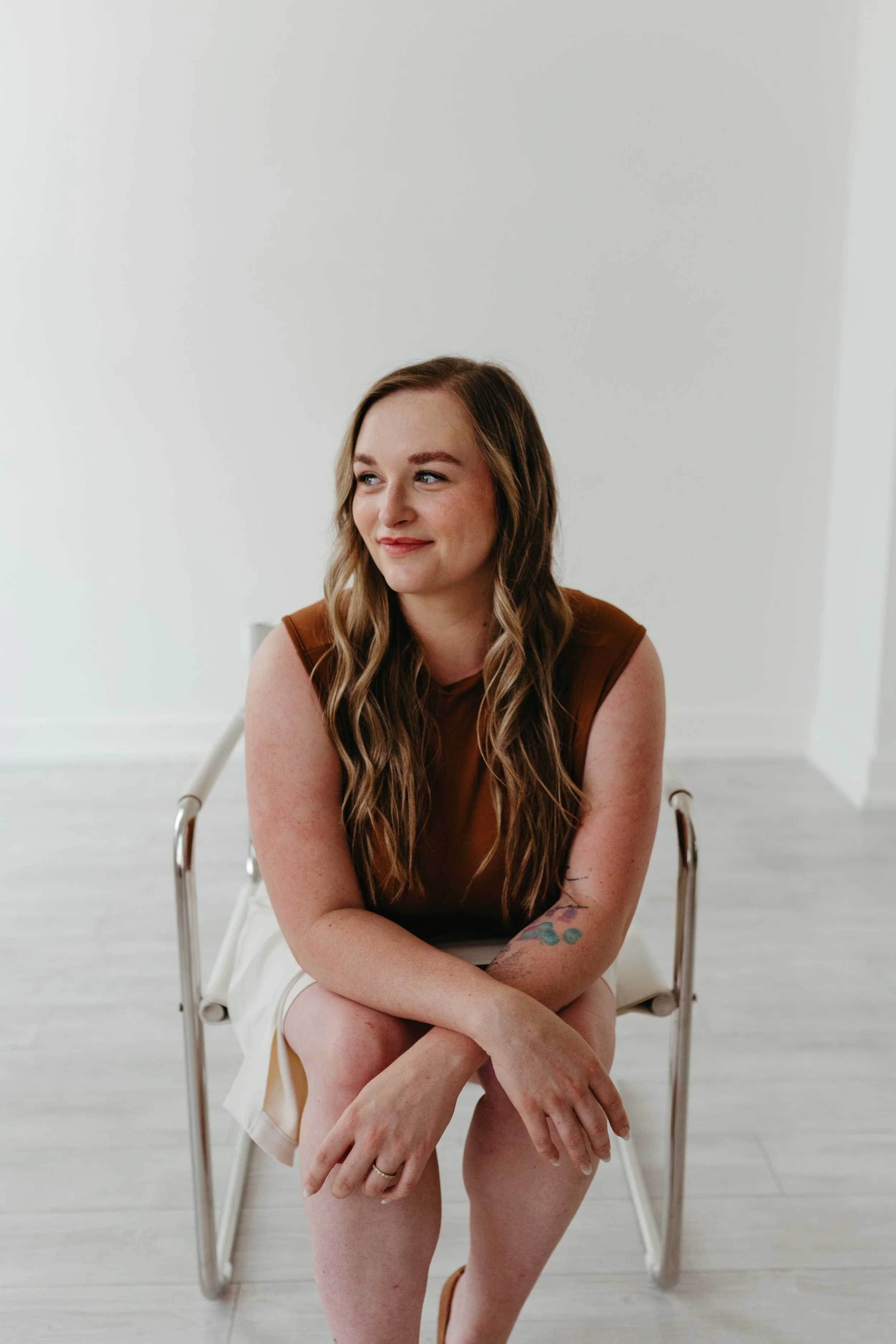 Elisabeth Jones sits the advanced aesthetician at Capitol Cryo Medspa in Salem Oregon and smiles