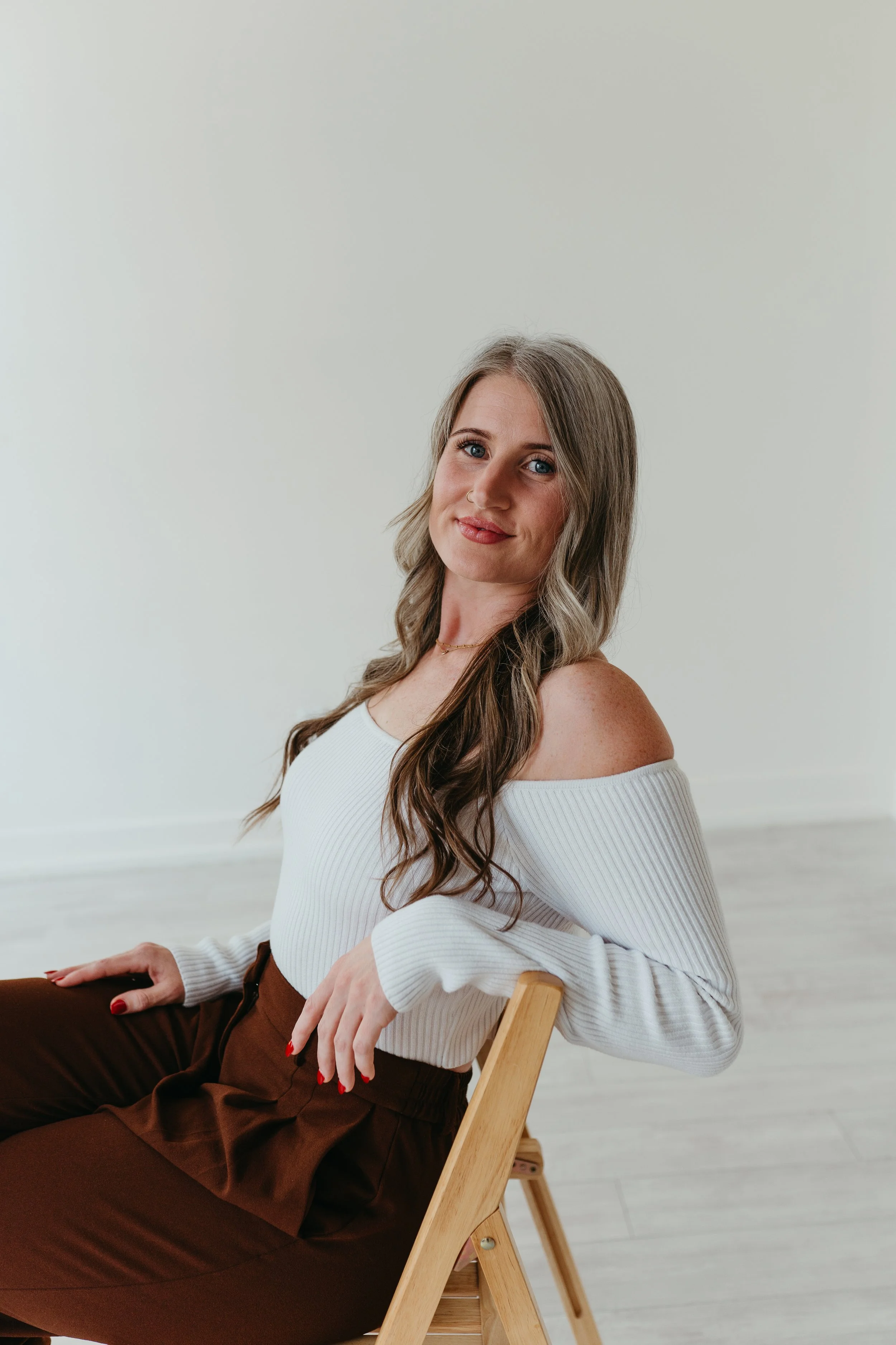 Kristen Colvin the Lead Esthetician at Capitol Cryo is sitting and smiling in Salem, OR