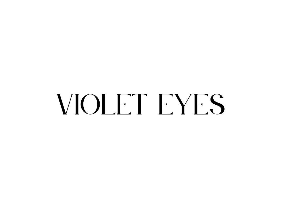 Text on a white background that says 'VIOLET EYES' in black, elegant font.