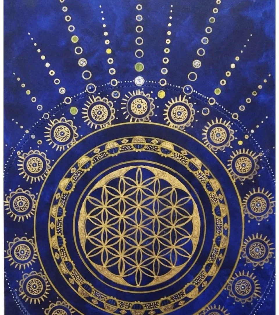 Gold geometric and circular designs on a deep blue background, resembling a mandala or sacred geometry pattern.