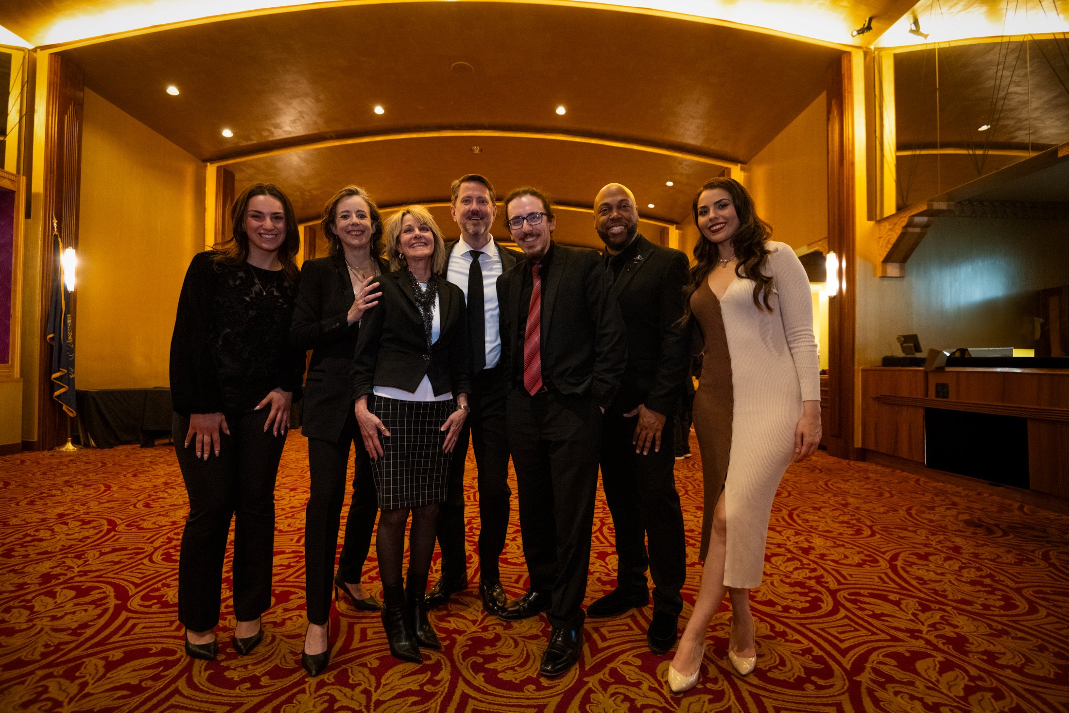 Group photo of Philharmonic staff and soloists after Carmina Burana