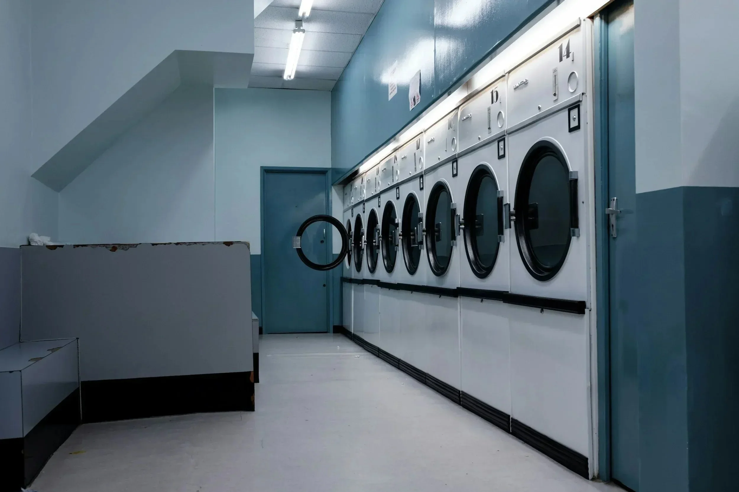 Commercial dryer vent cleaning service for laundromats with multiple industrial dryers improving airflow and safety