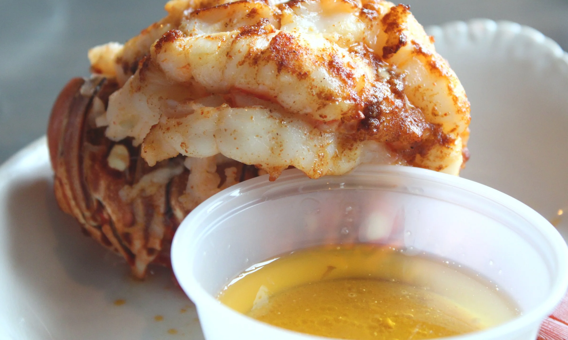 A lobster with a pool of butter 