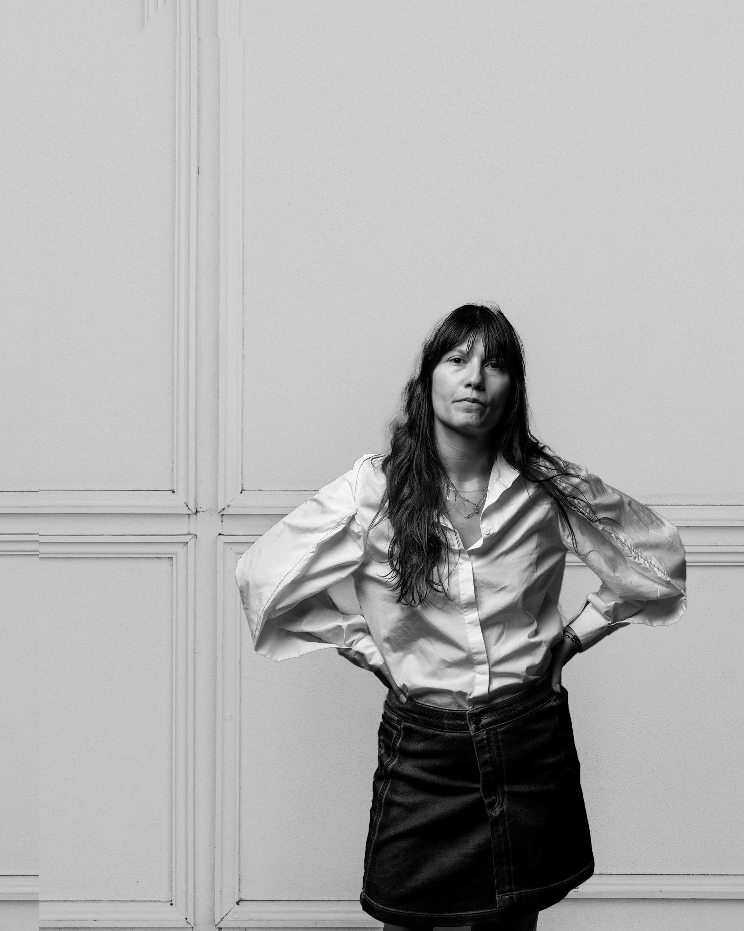 Abstract illustration resembling the word 'Milk' in gray, made up of geometric shapes and lines on a white background.